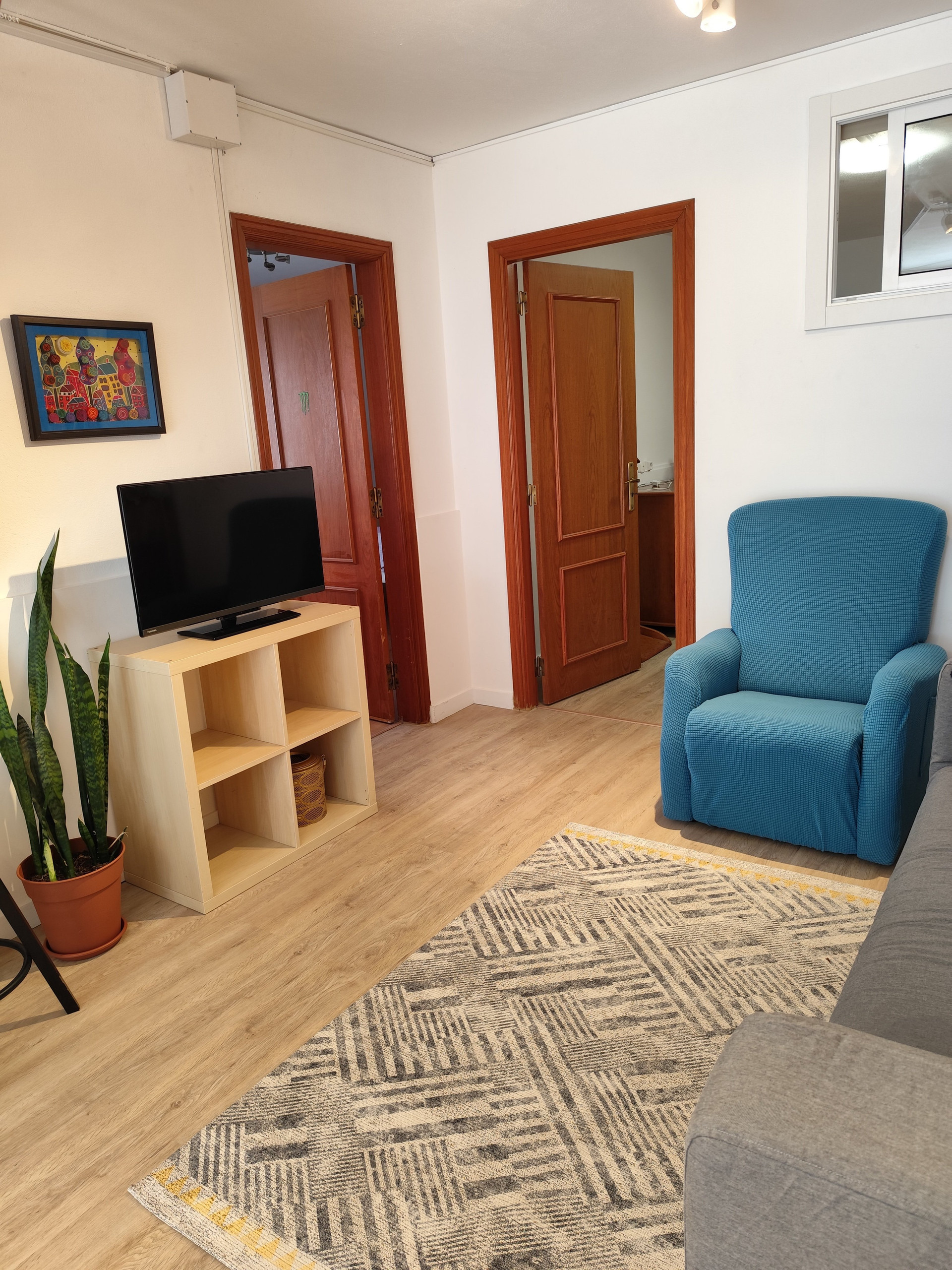 Living room with TV and armchair
