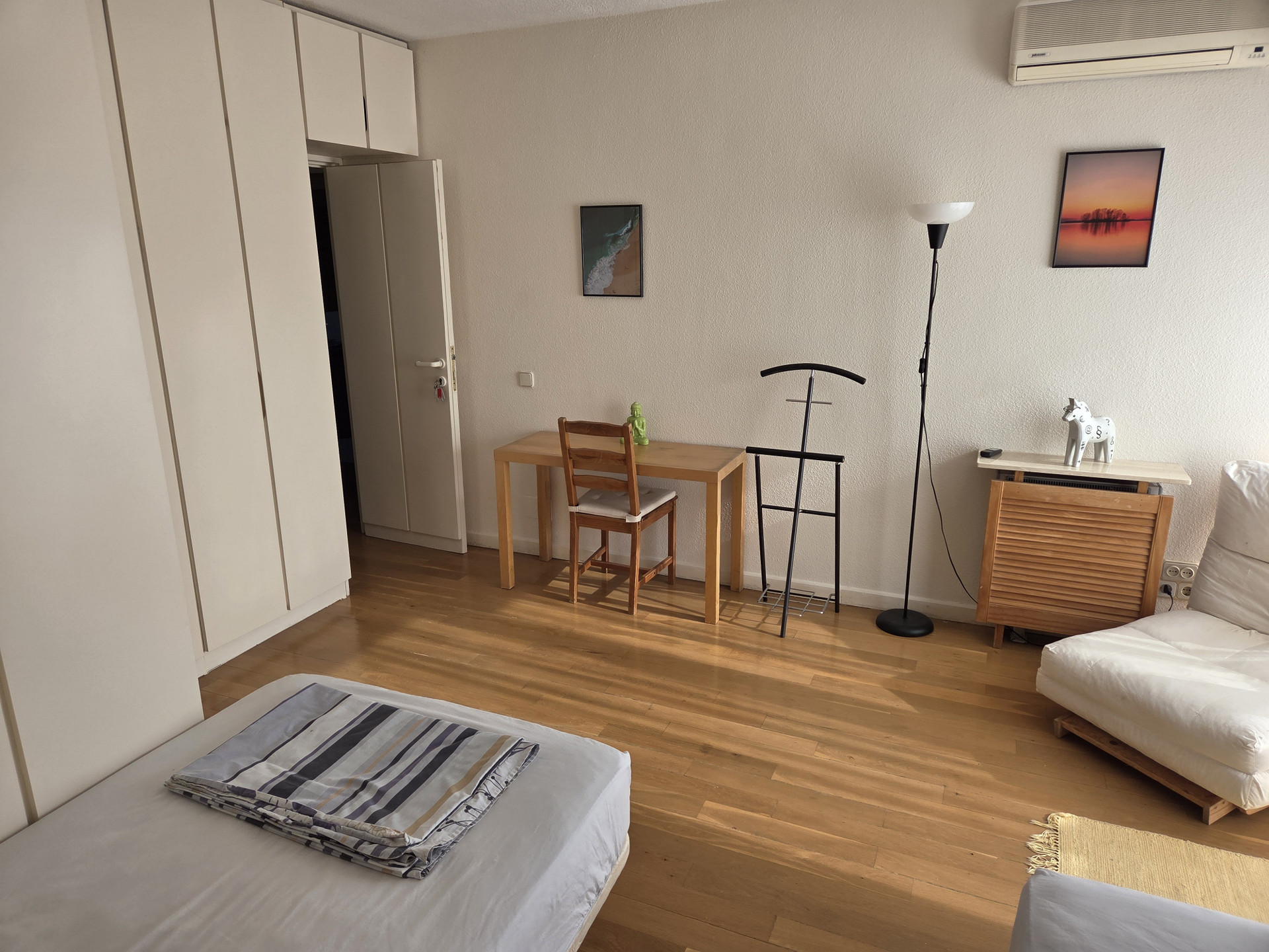 Bedroom with two beds desk
