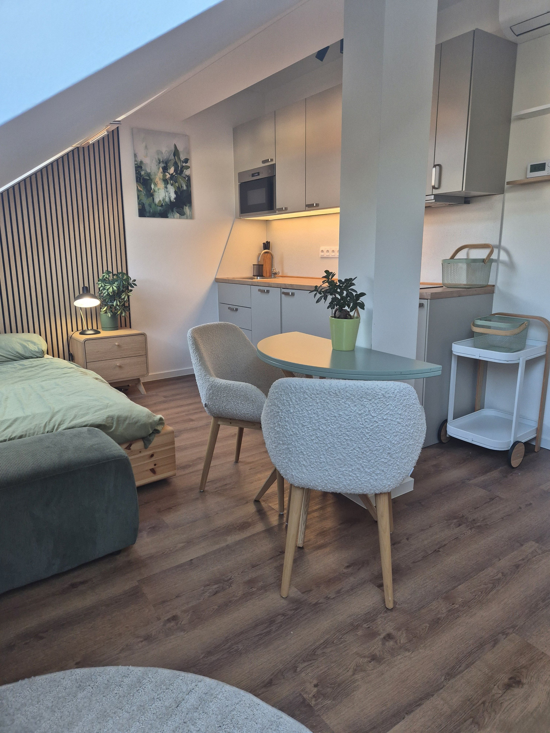 Attic studio with bed and dining