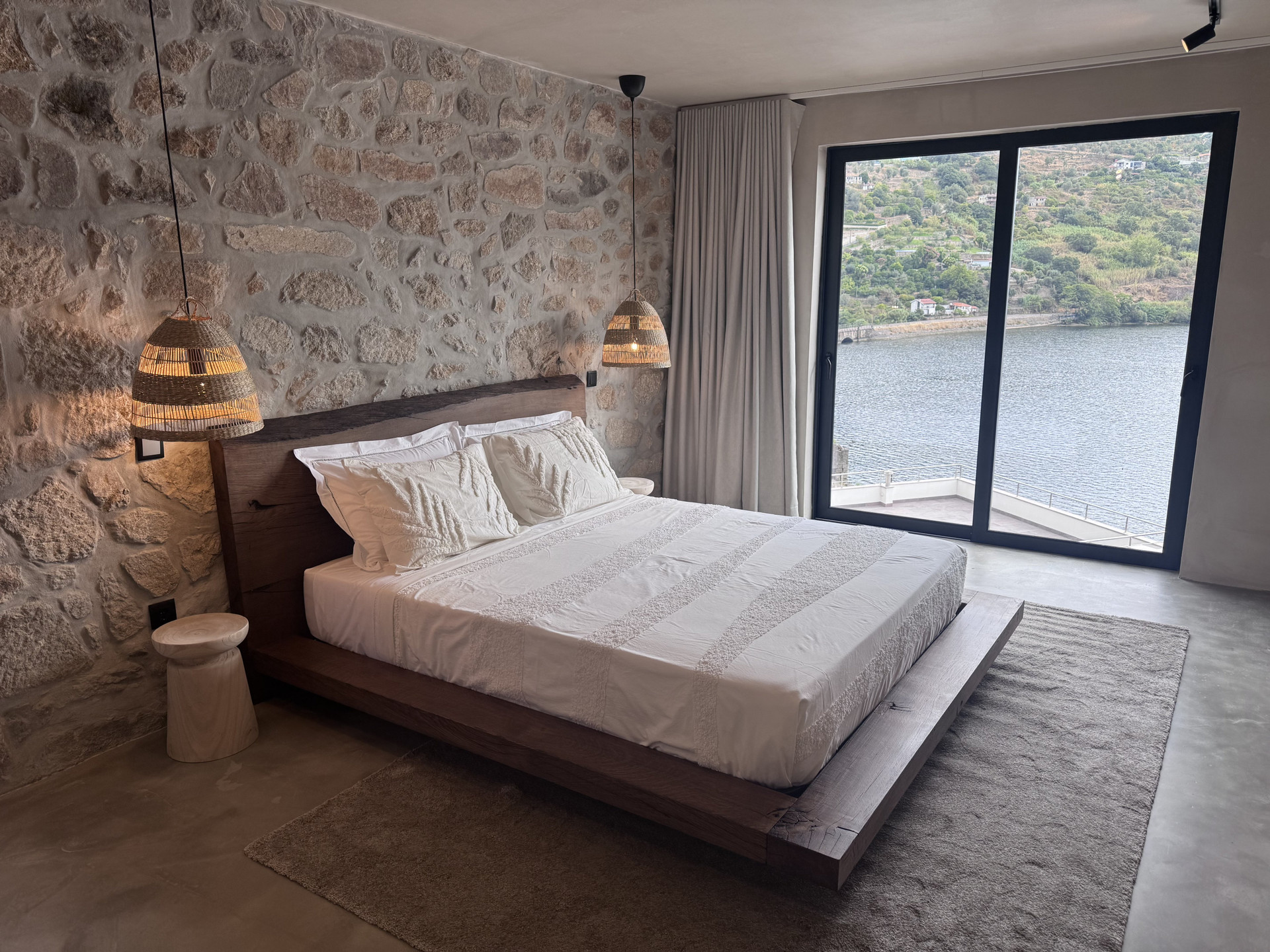 Bedroom with balcony river view