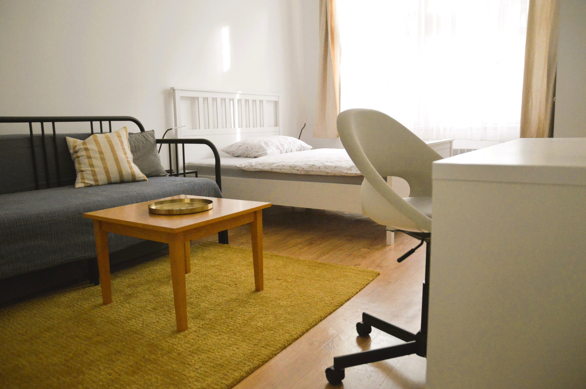 Sofa, bed, and desk area