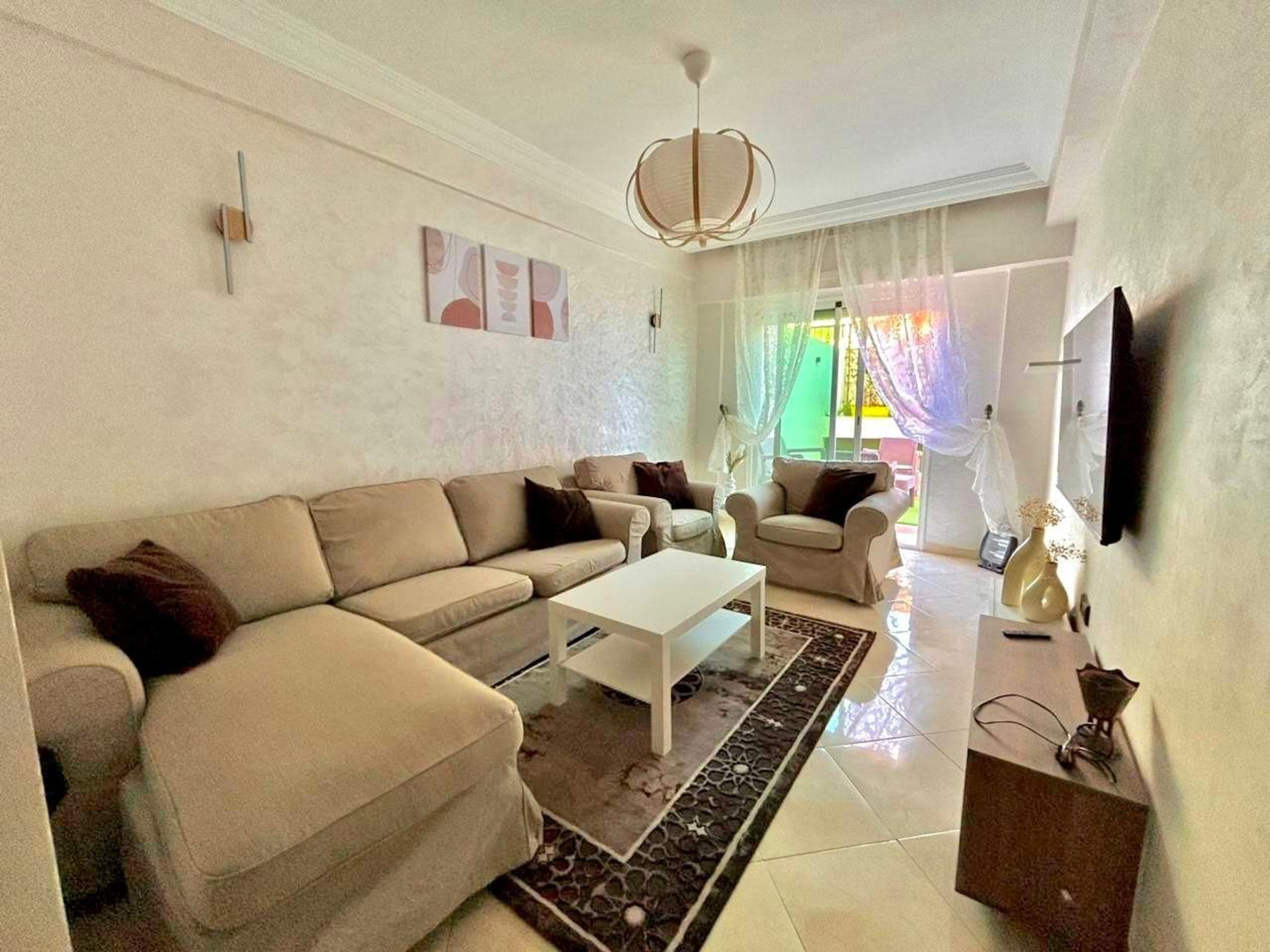 Bright living room with sofas and TV