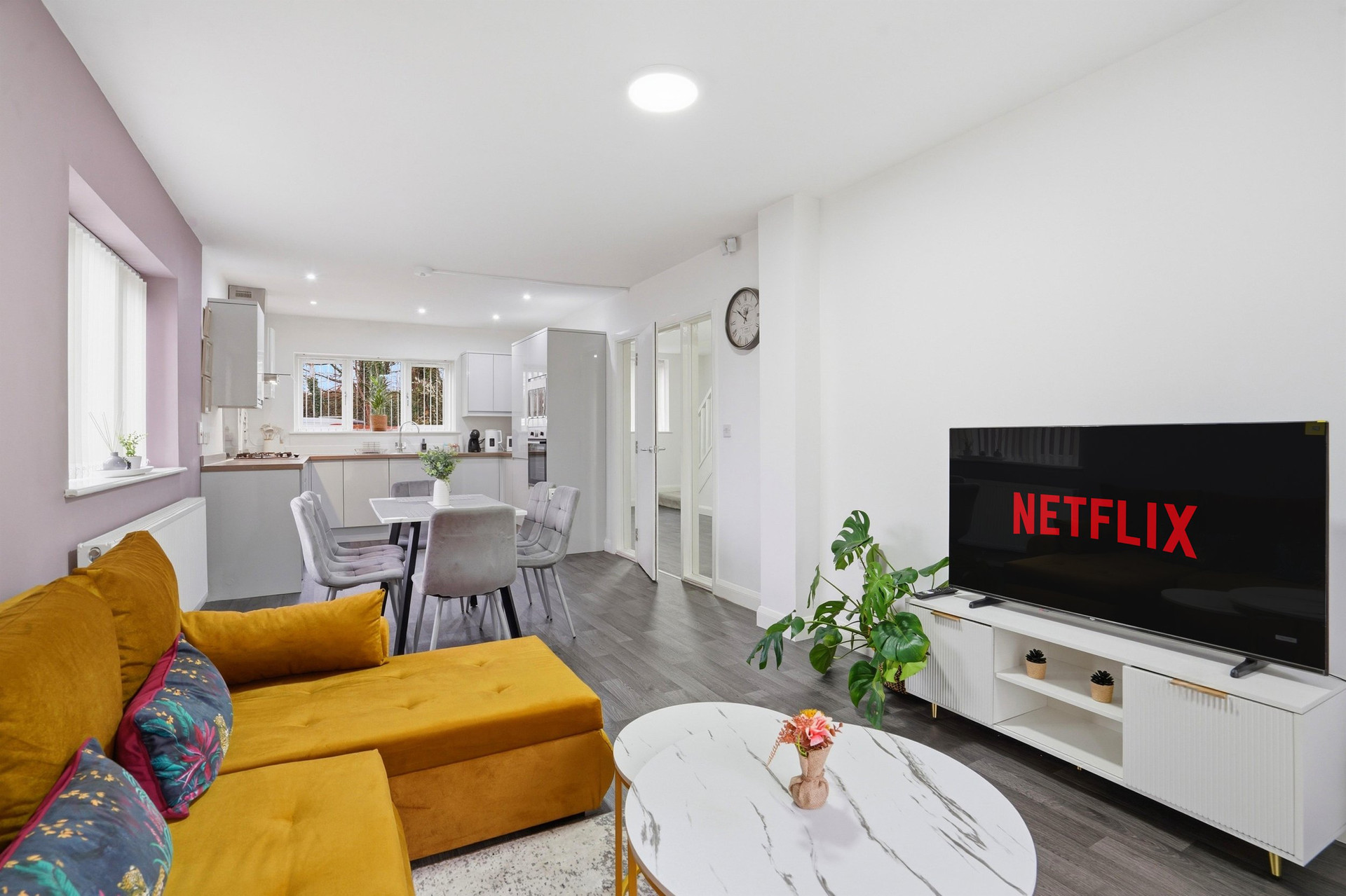 Living room with TV and kitchen
