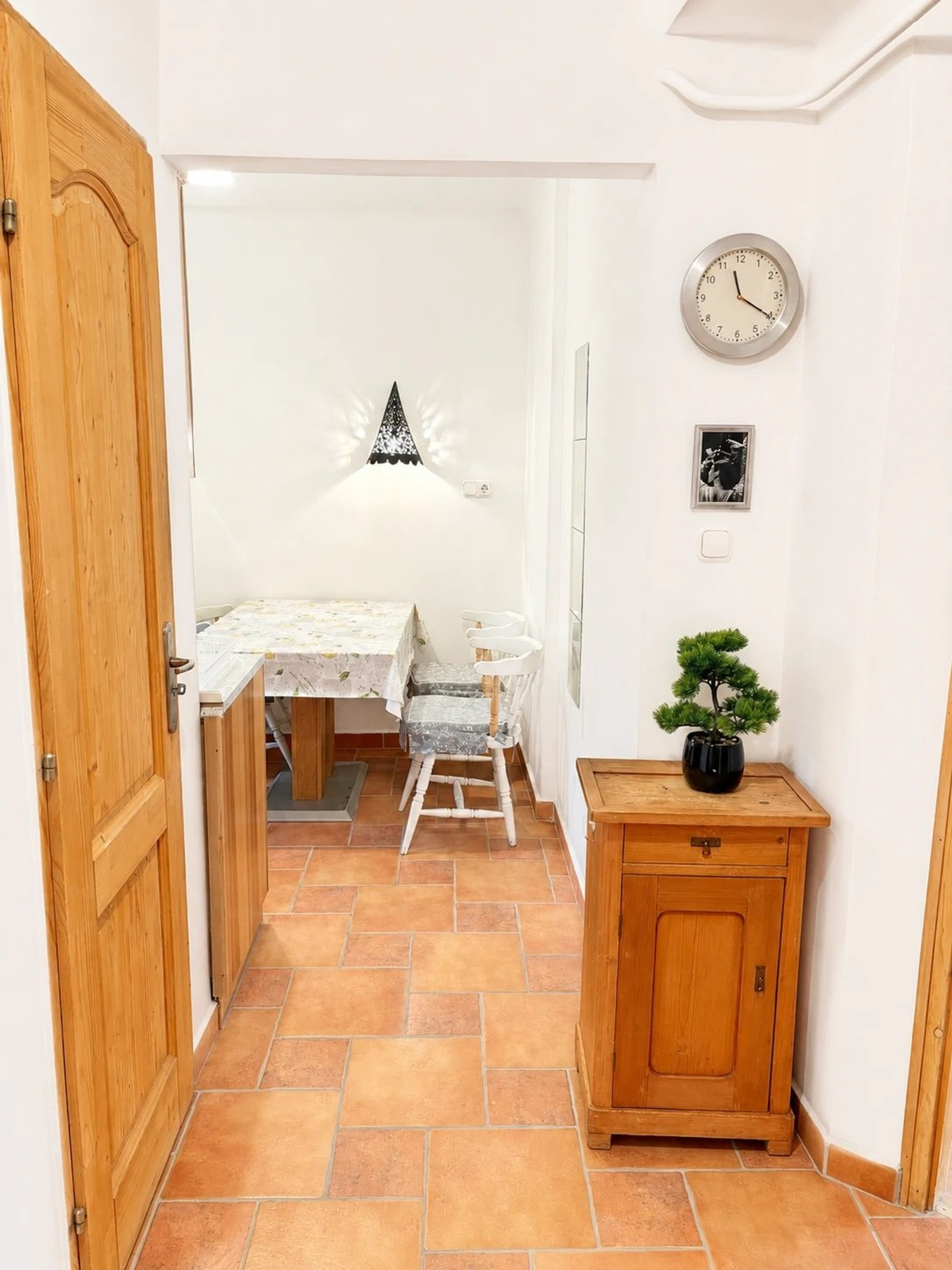 Hallway with dining nook and cabinet