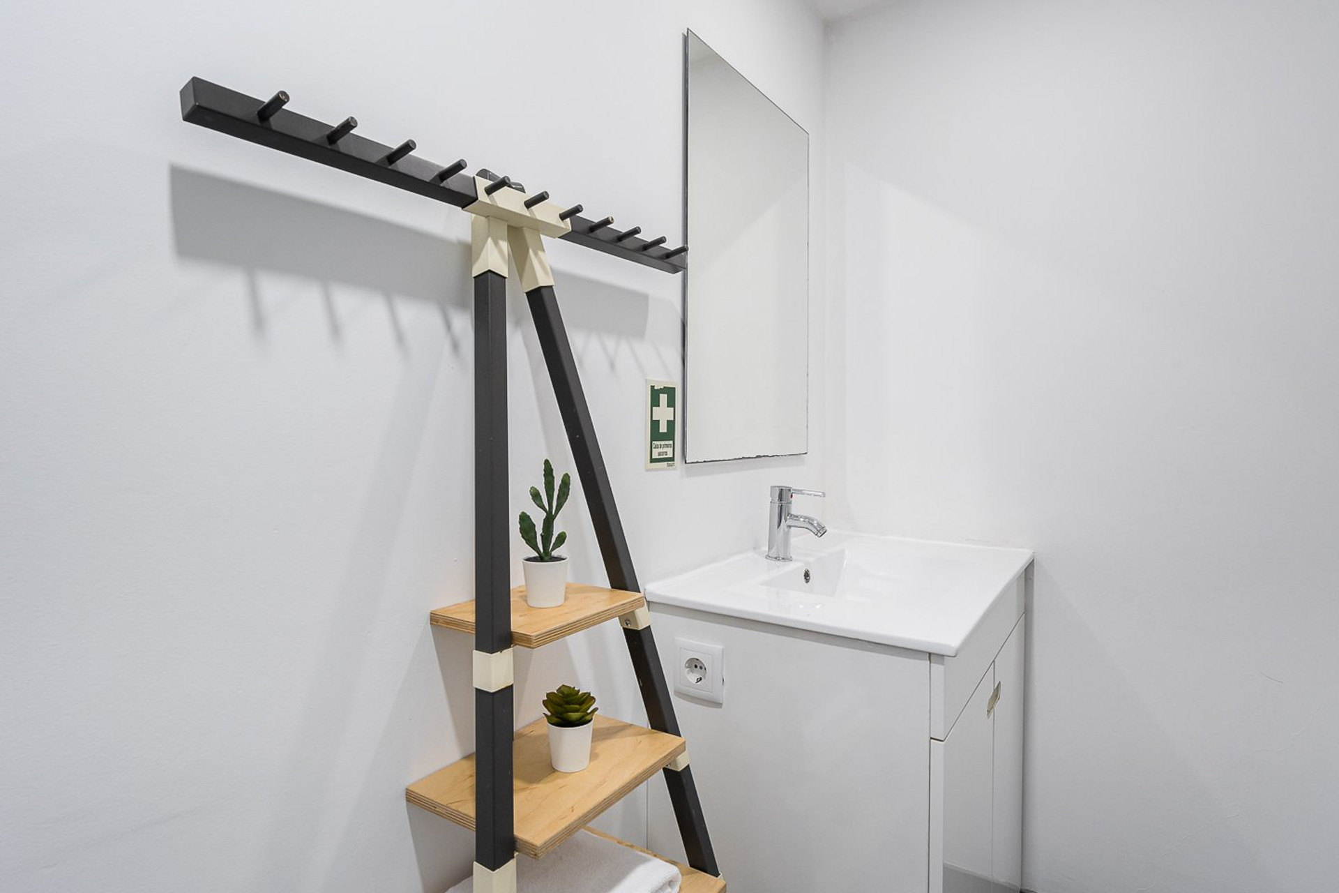 Bathroom vanity with coat rack
