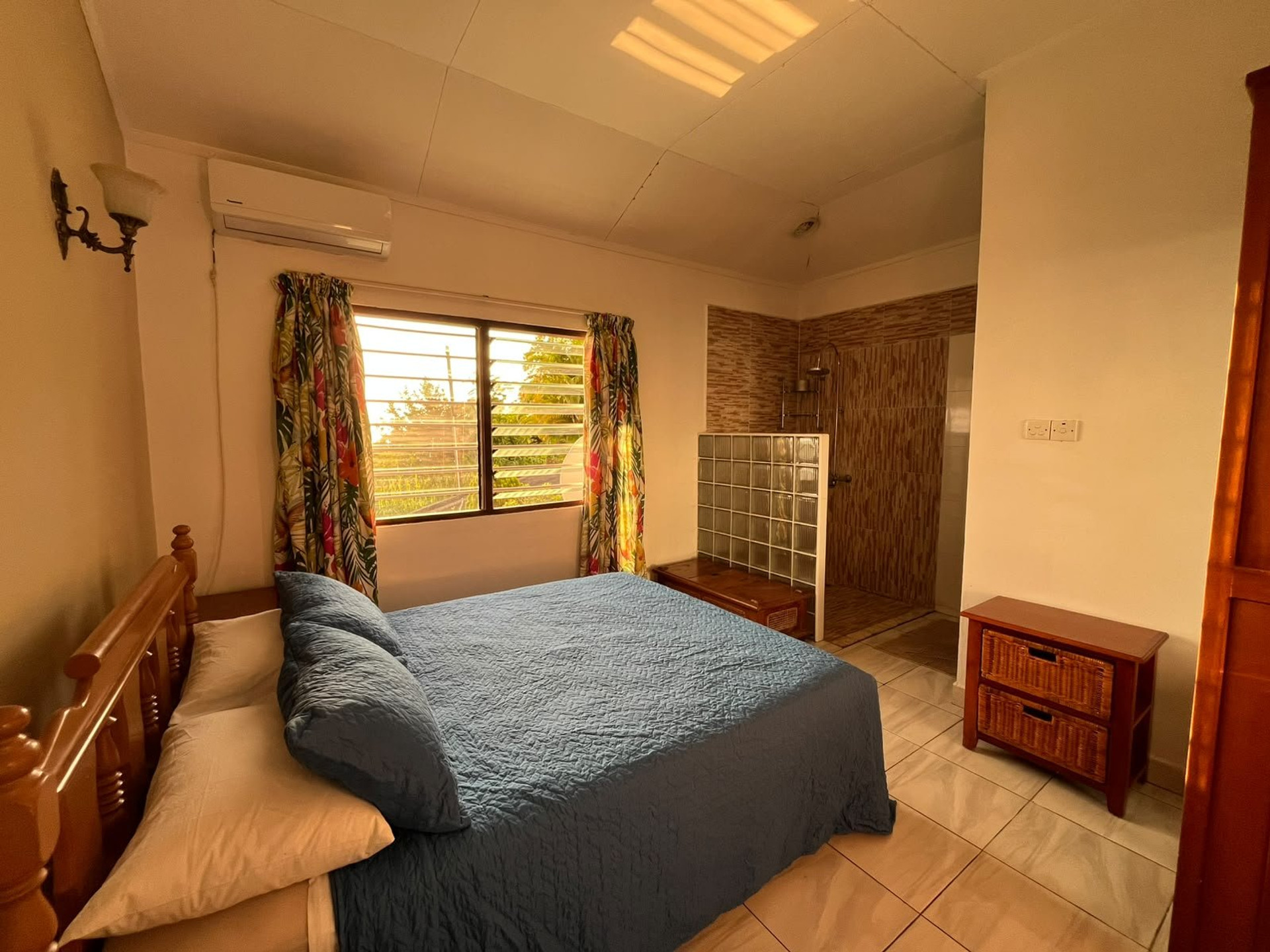 Bedroom with open shower area