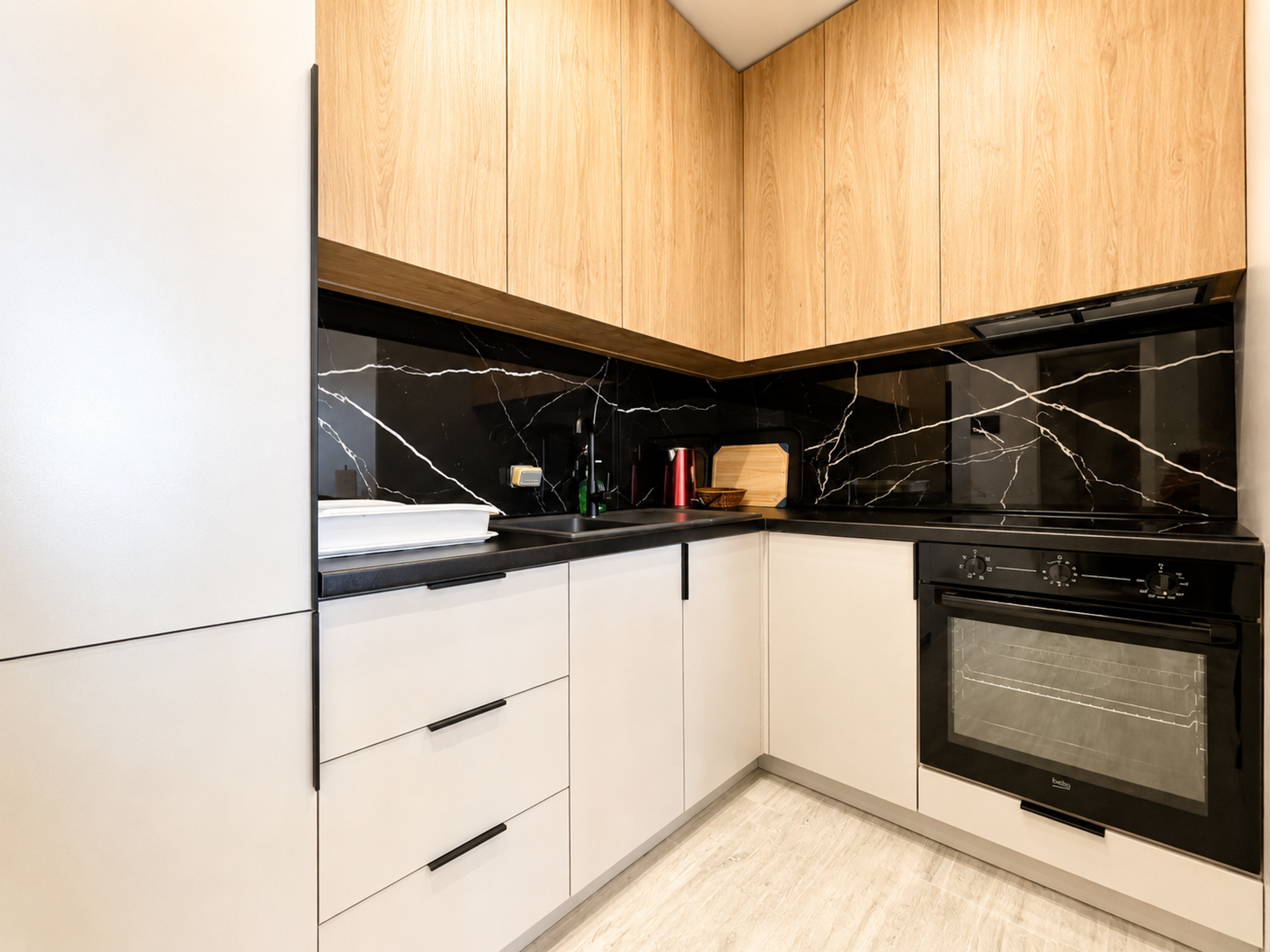 Kitchen black marble backsplash oven