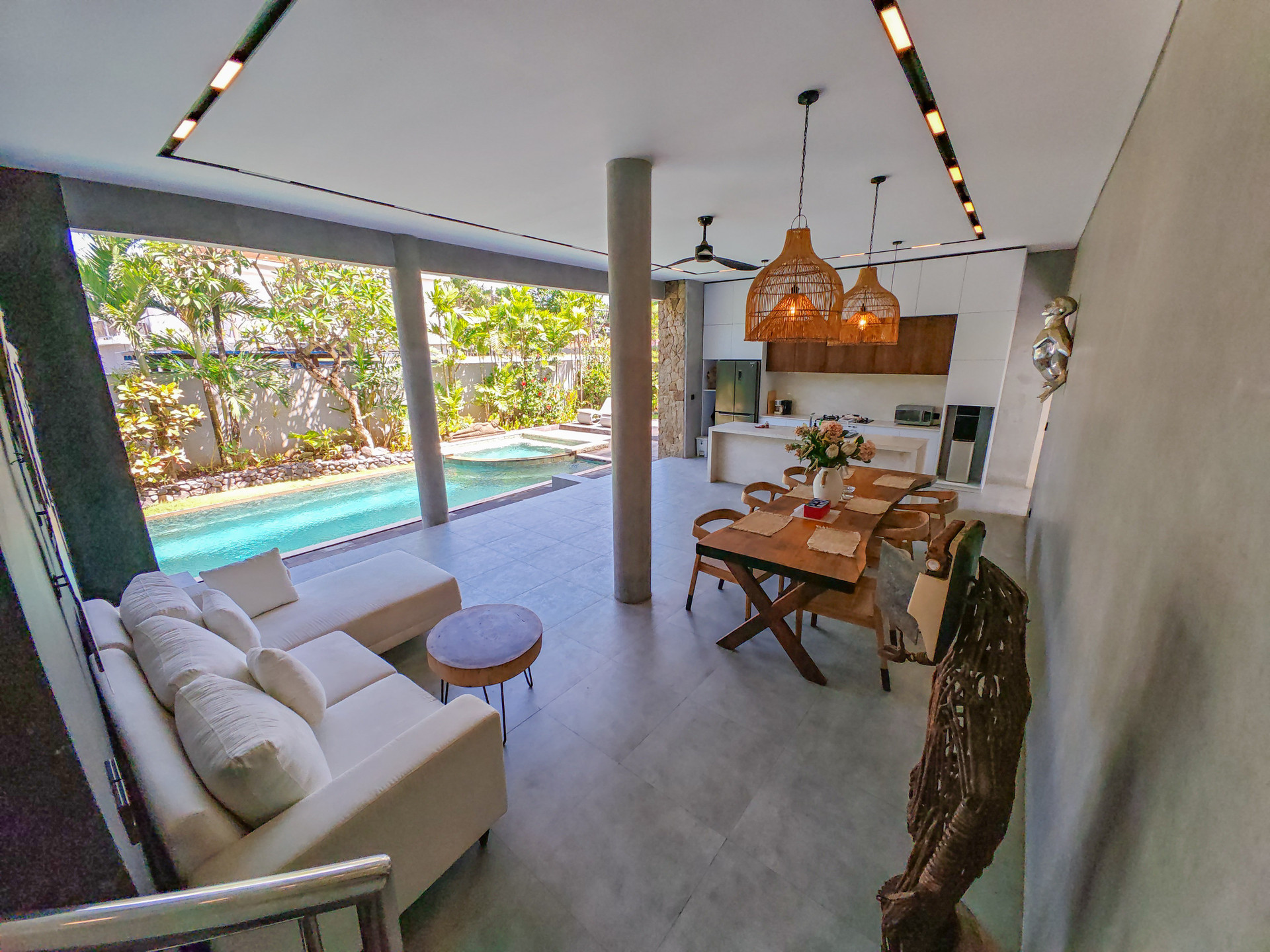 Open living dining kitchen pool view