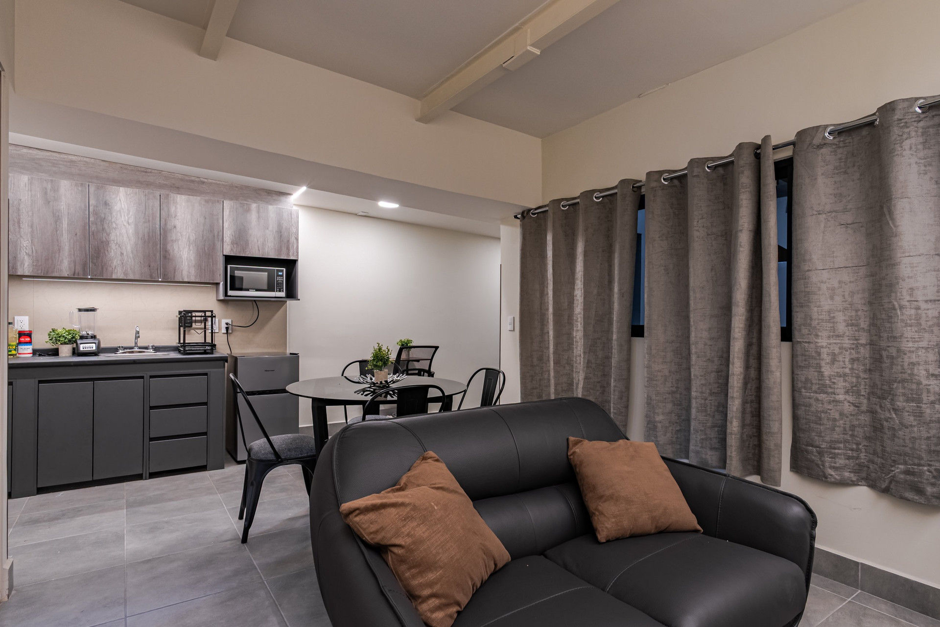Open living space with kitchen and sofa