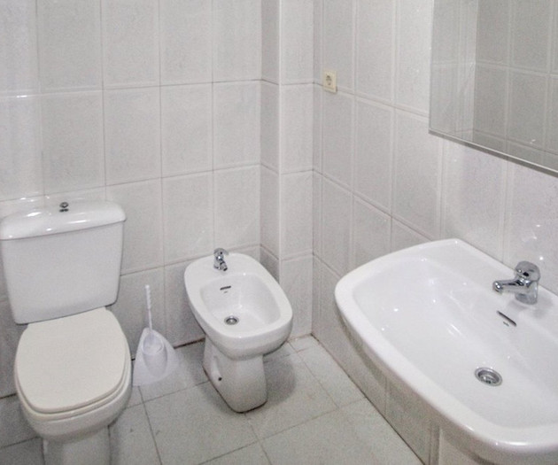 Bright white bathroom with sink