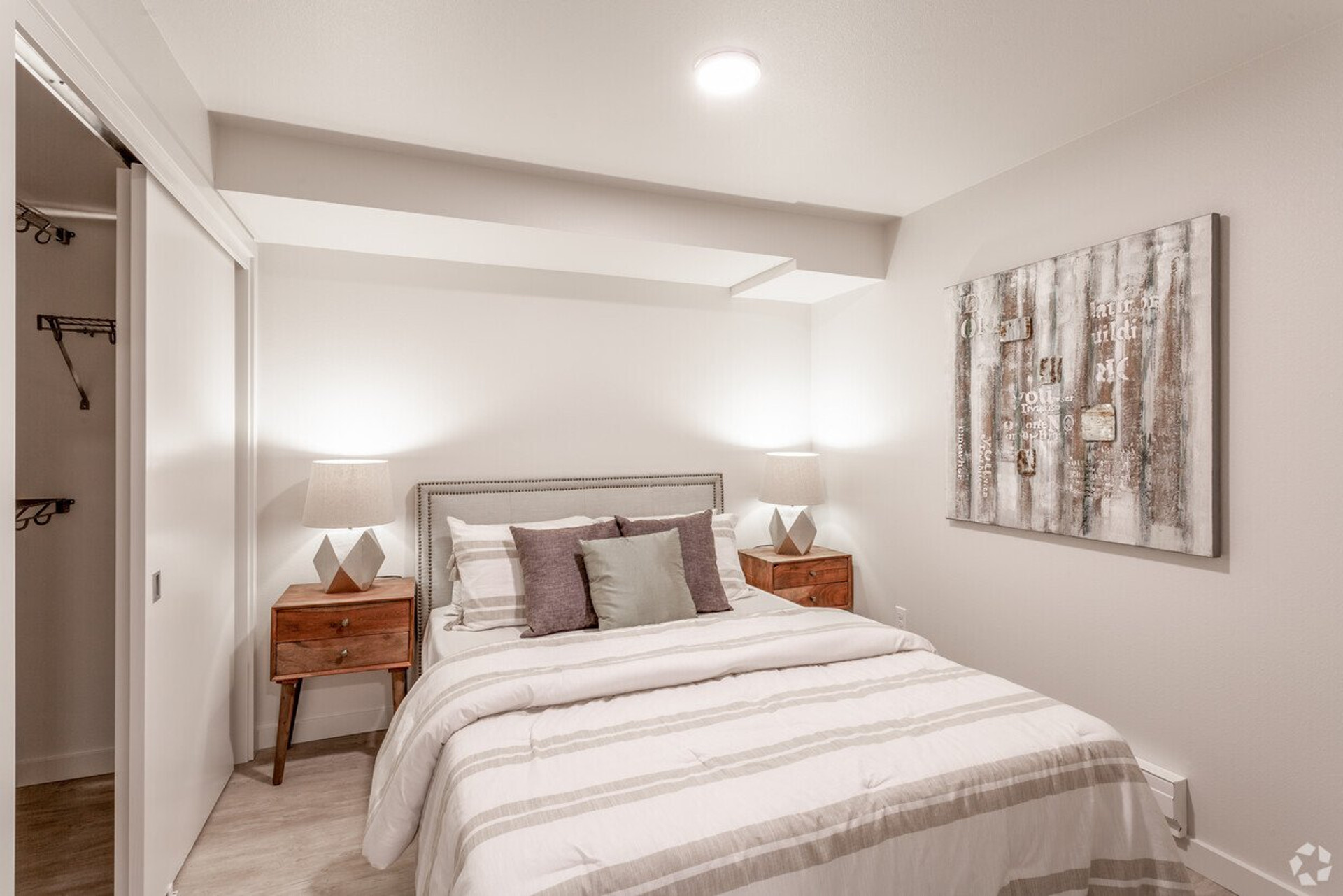 Cozy bedroom with nightstands and closet