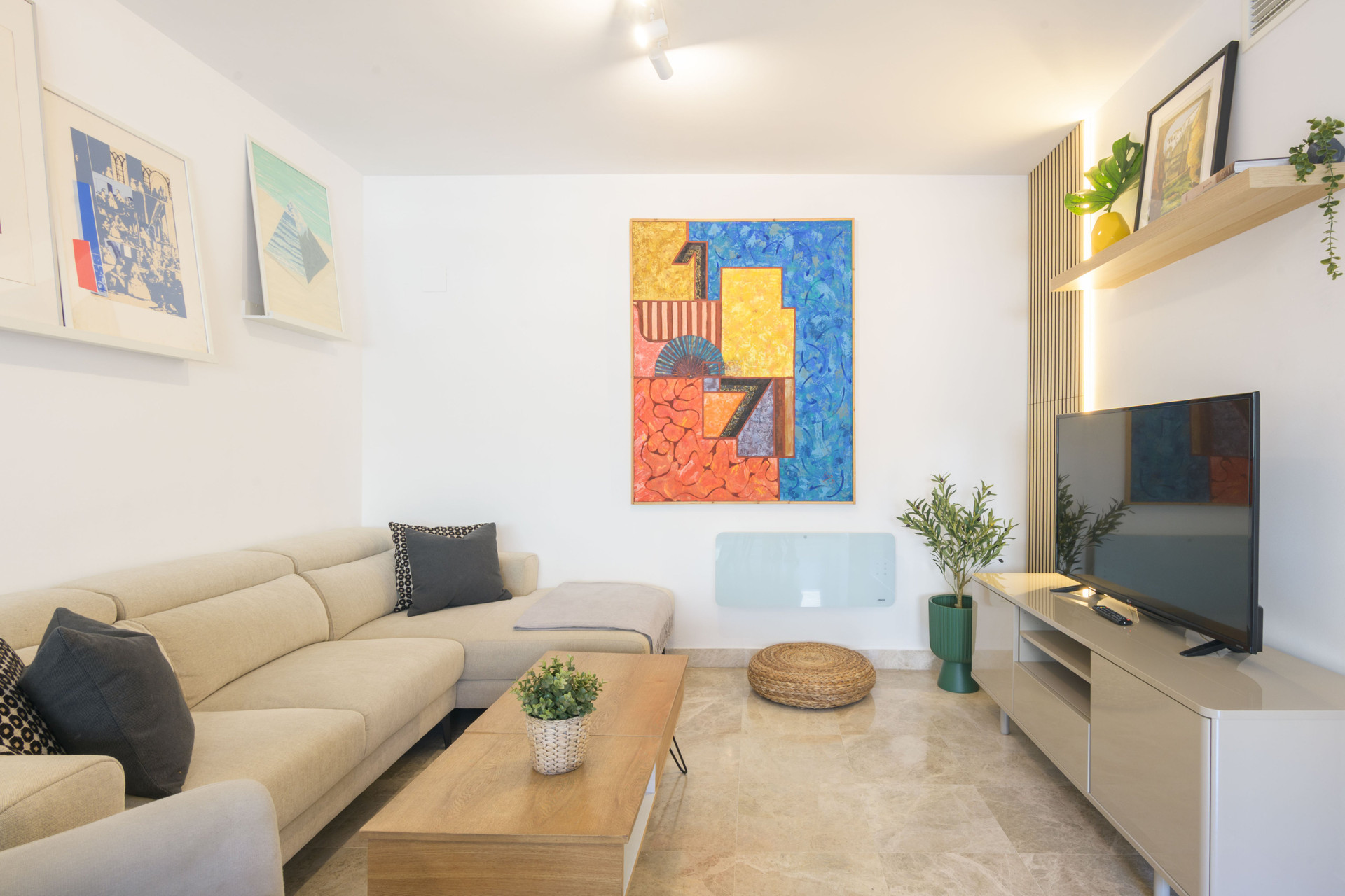 Living room with TV and art
