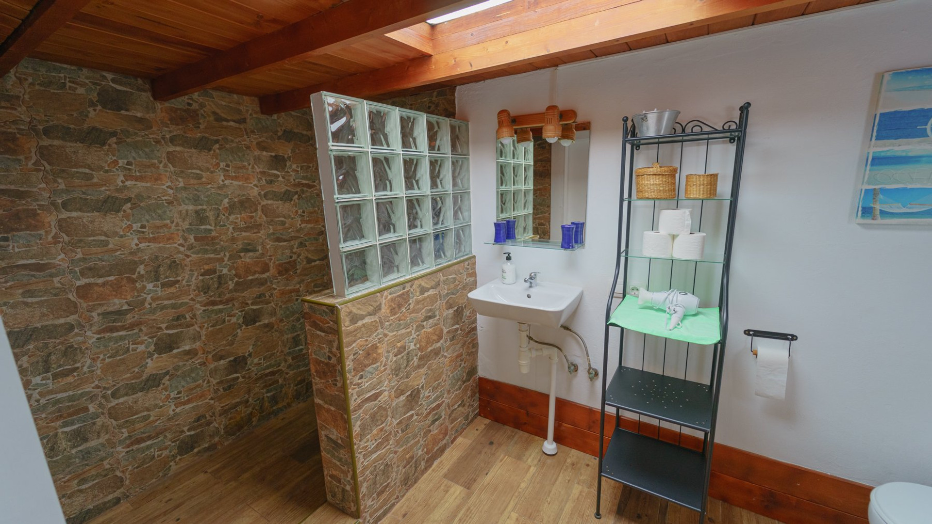 Bathroom with stone wall and glass blocks