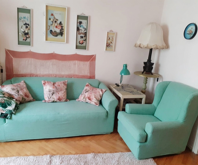 Living room with teal sofas