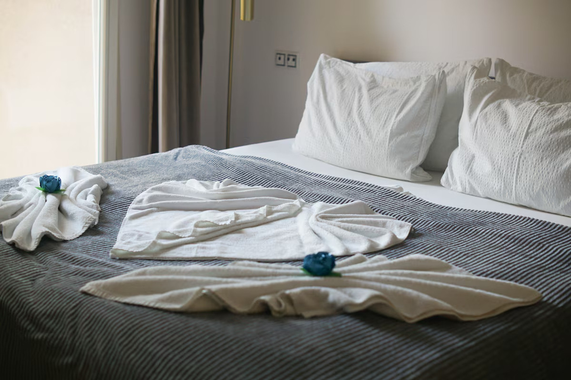 Double bed with decorative towels