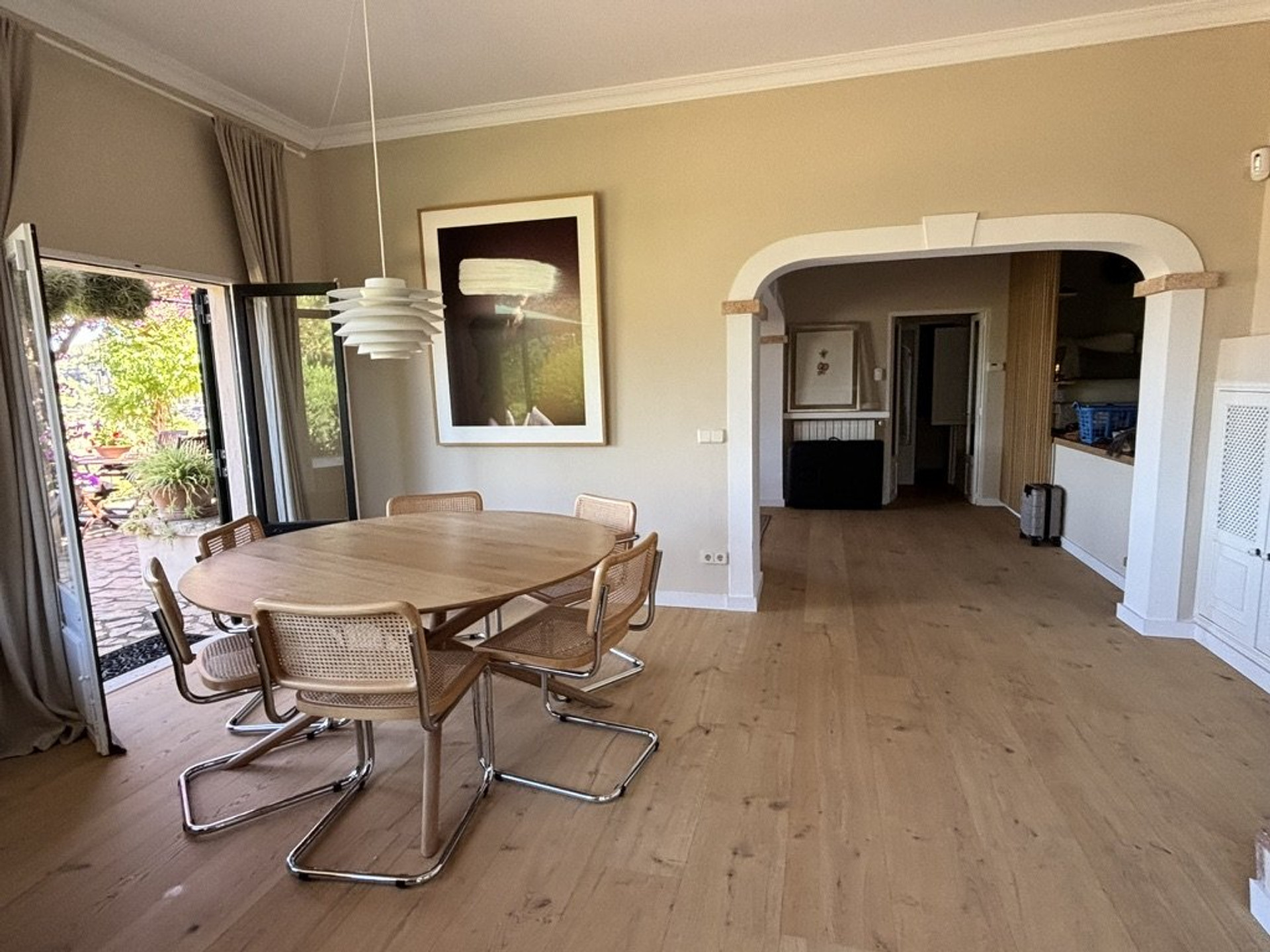 Spacious dining room with arched doorway