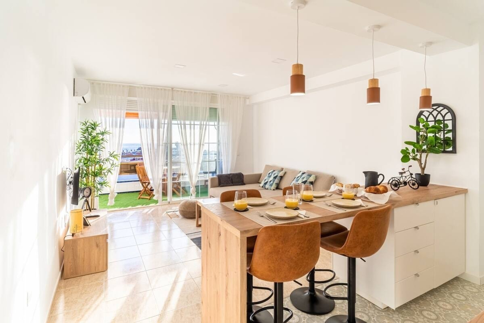 Living room with dining and balcony view