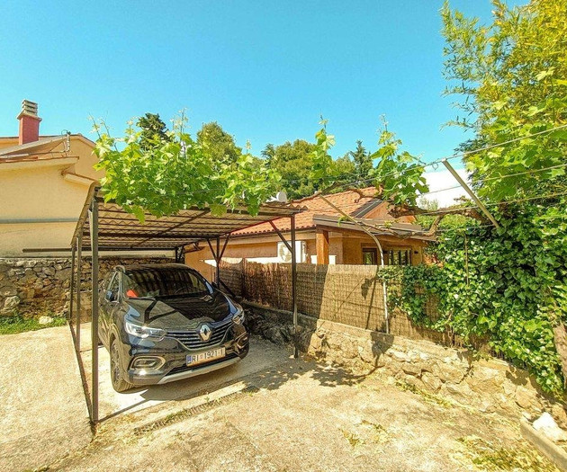Carport with parked car