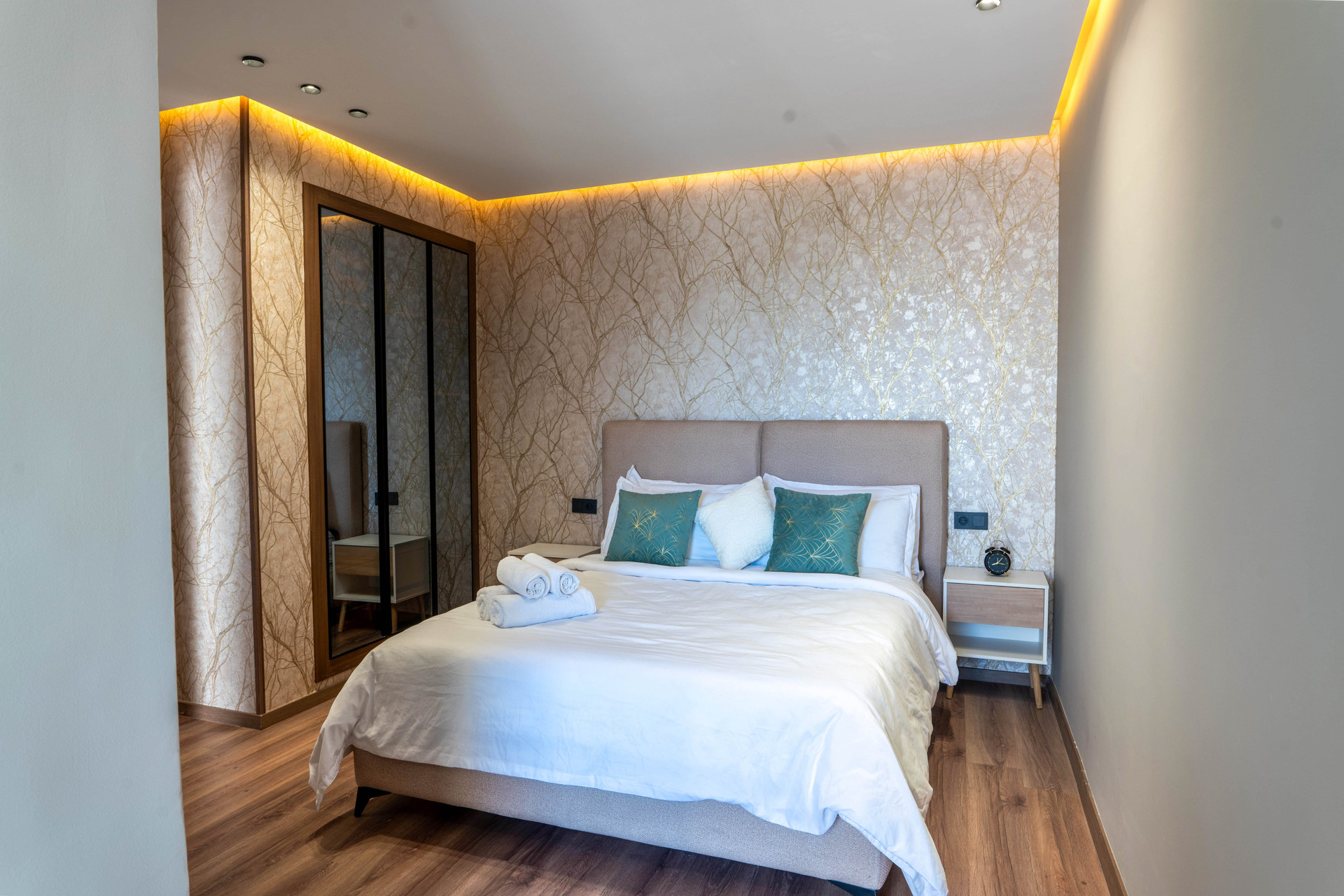 Bedroom with wallpaper accent wall