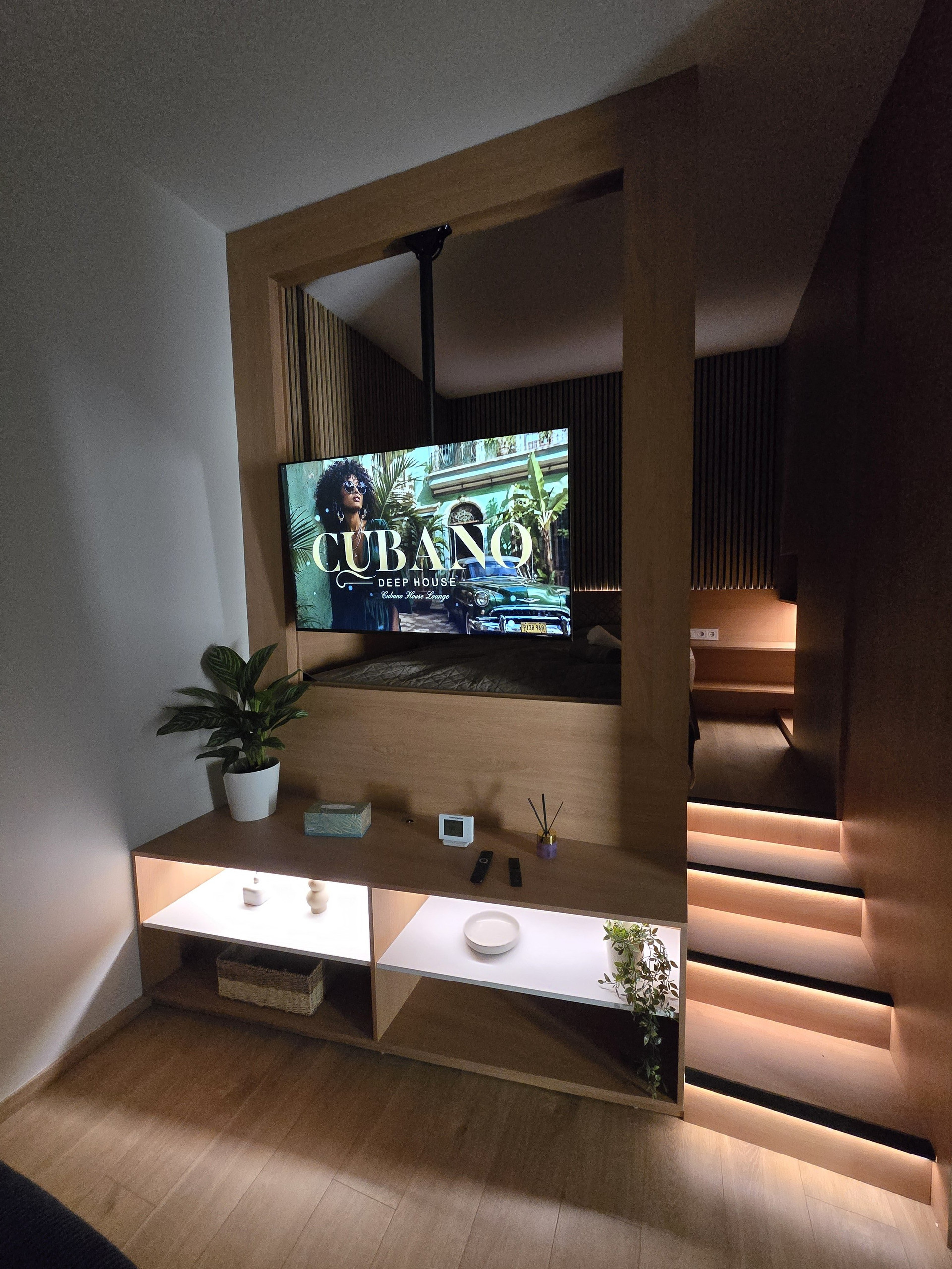 Living area with TV and lit steps