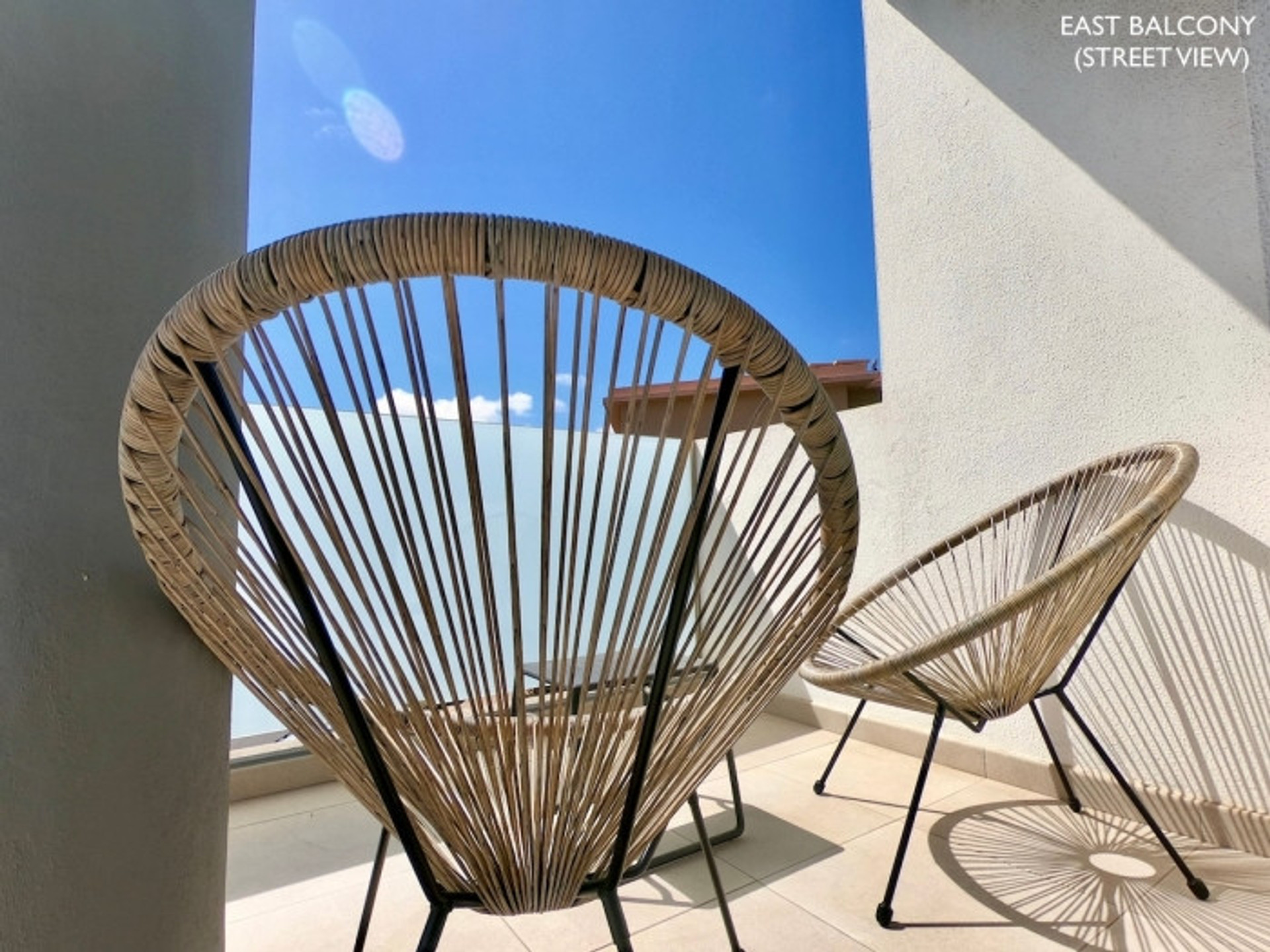 East balcony with rattan chairs