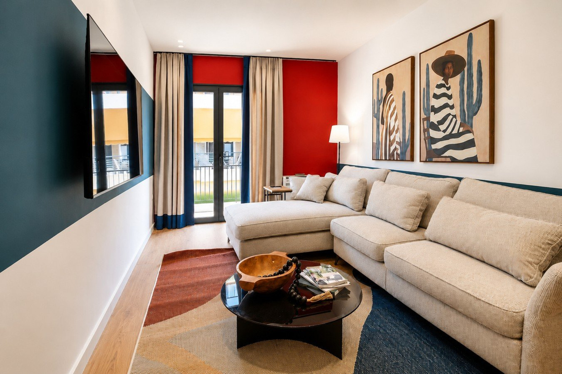 Living room with art and balcony