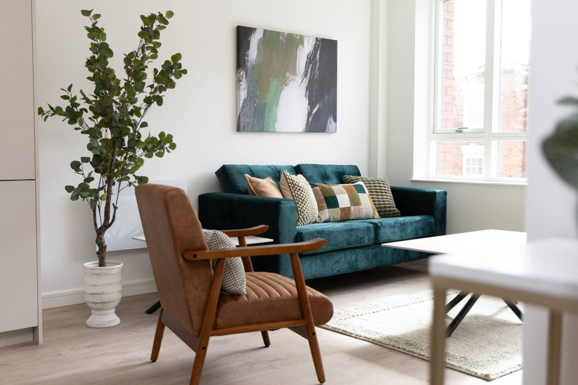 Living area with teal sofa