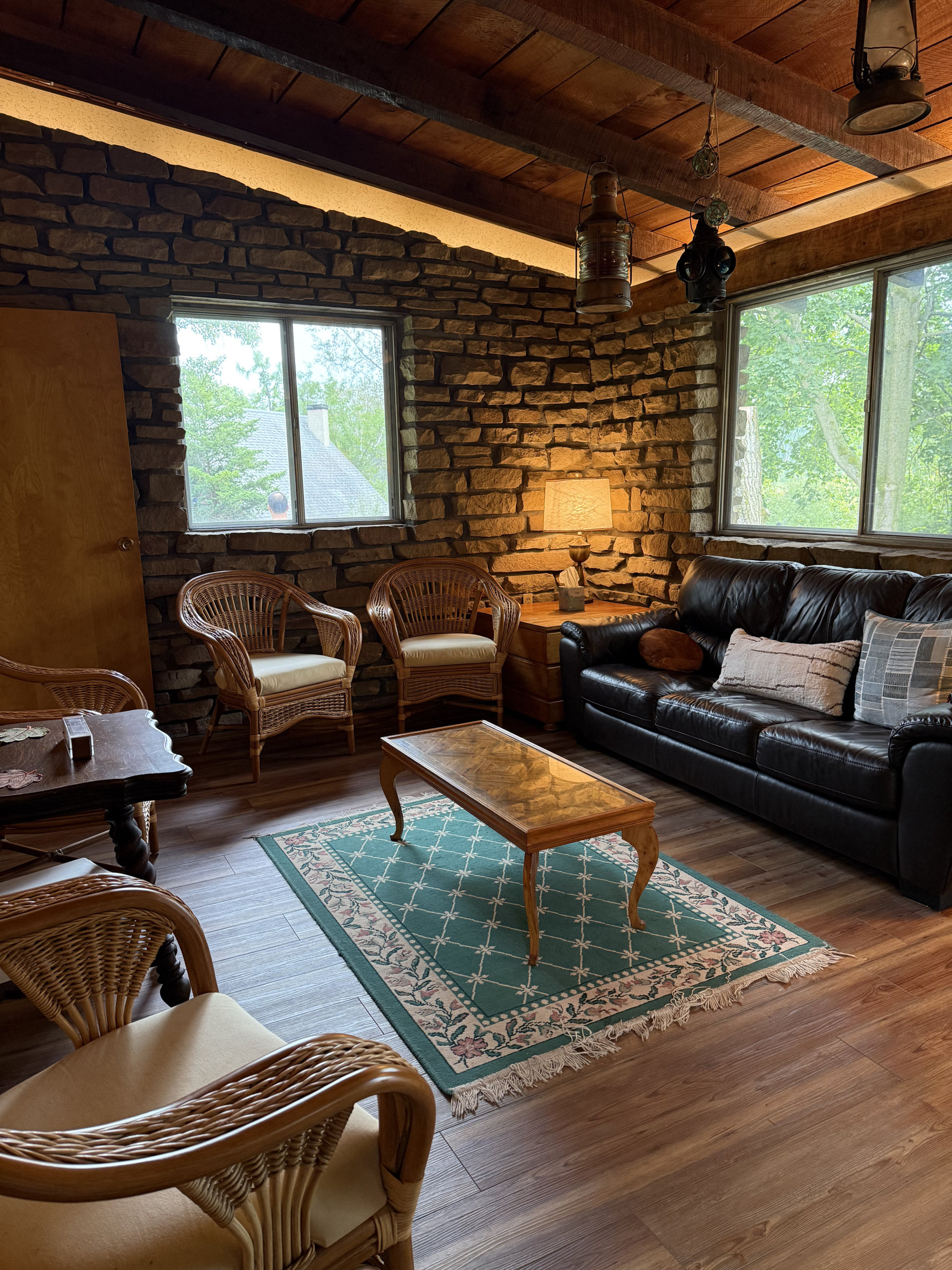 Stone-walled living room with leather sofa