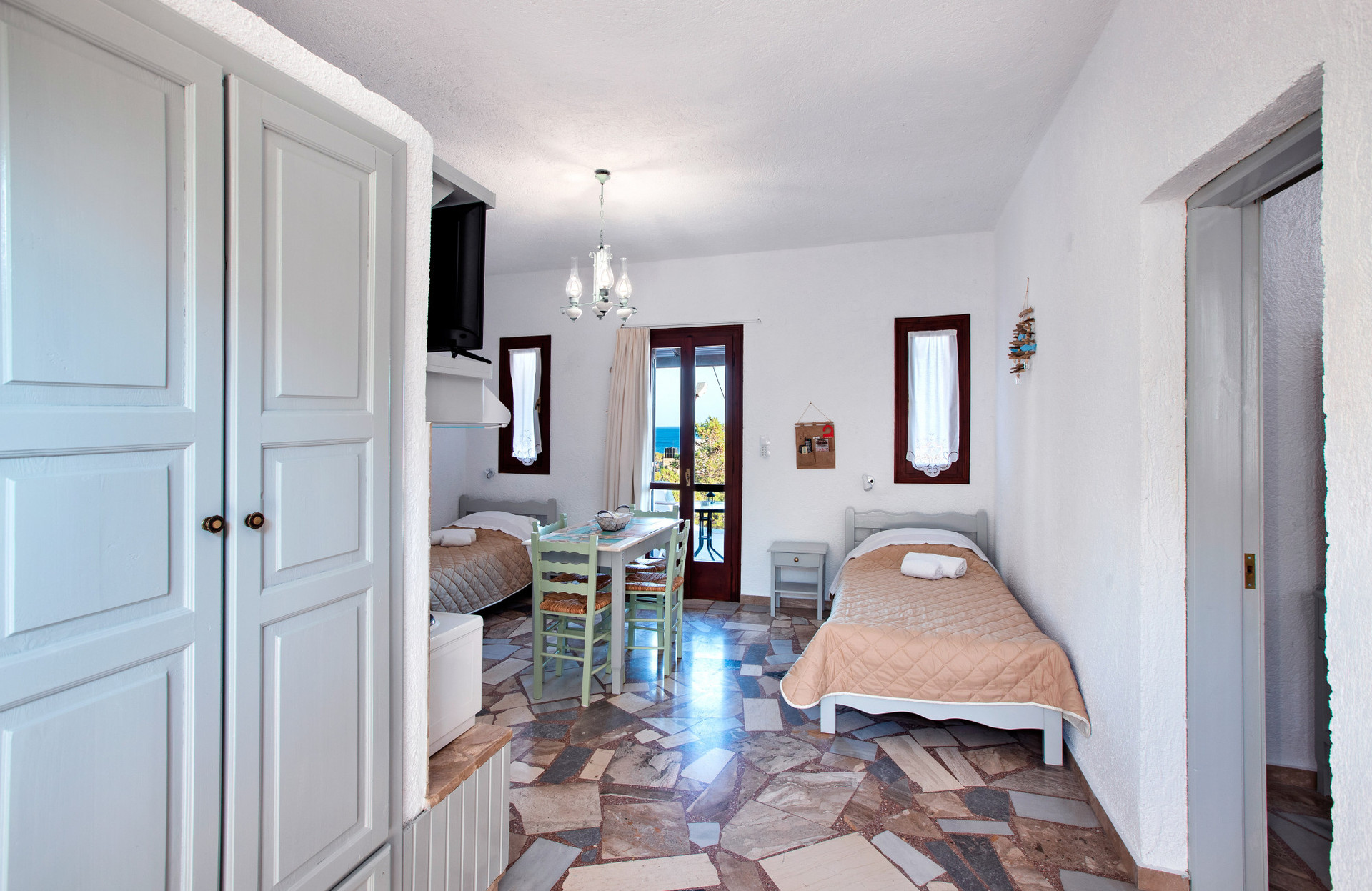 View of the living room and wardrobe from the hallway