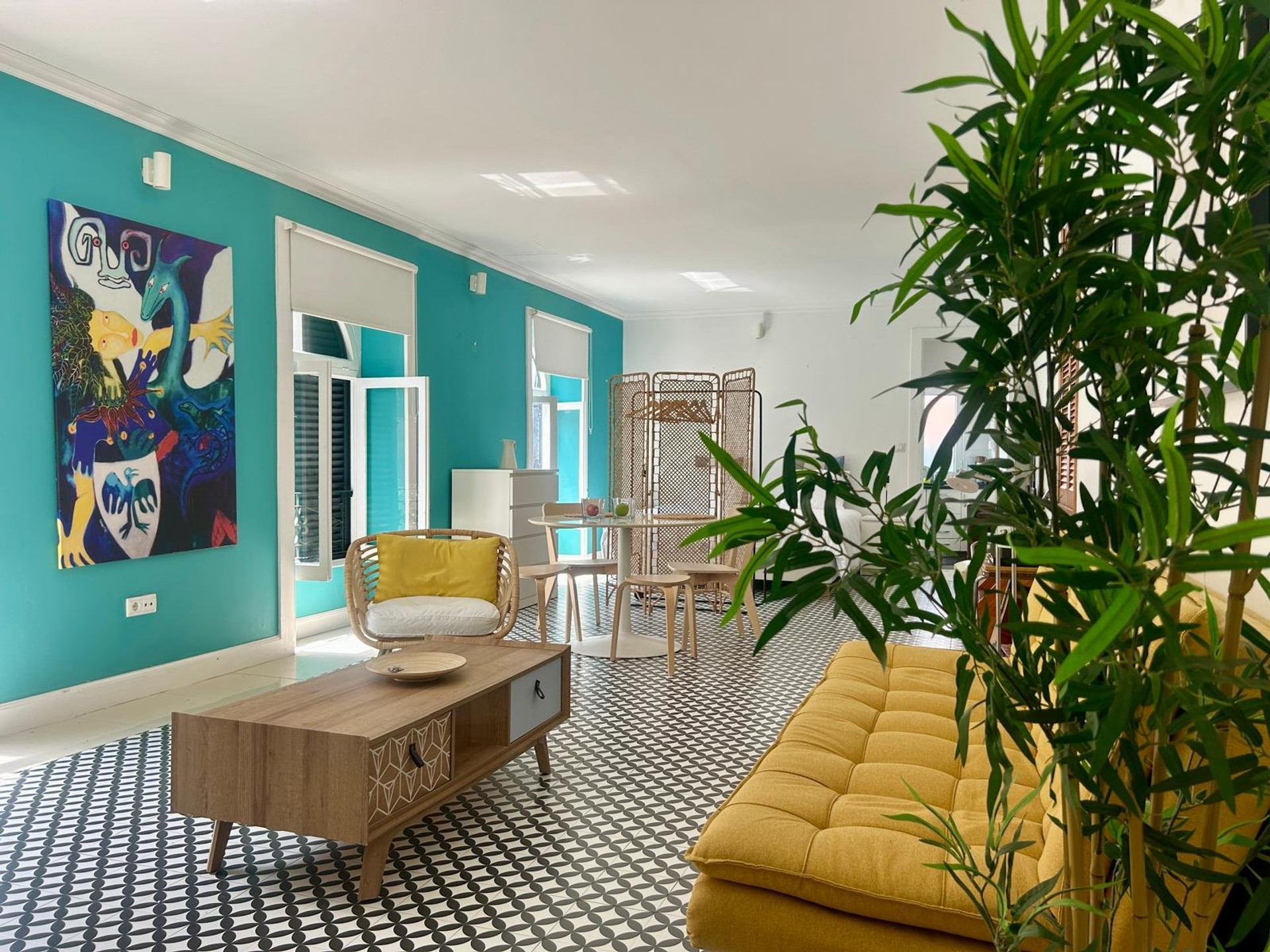 Bright living area with yellow sofa