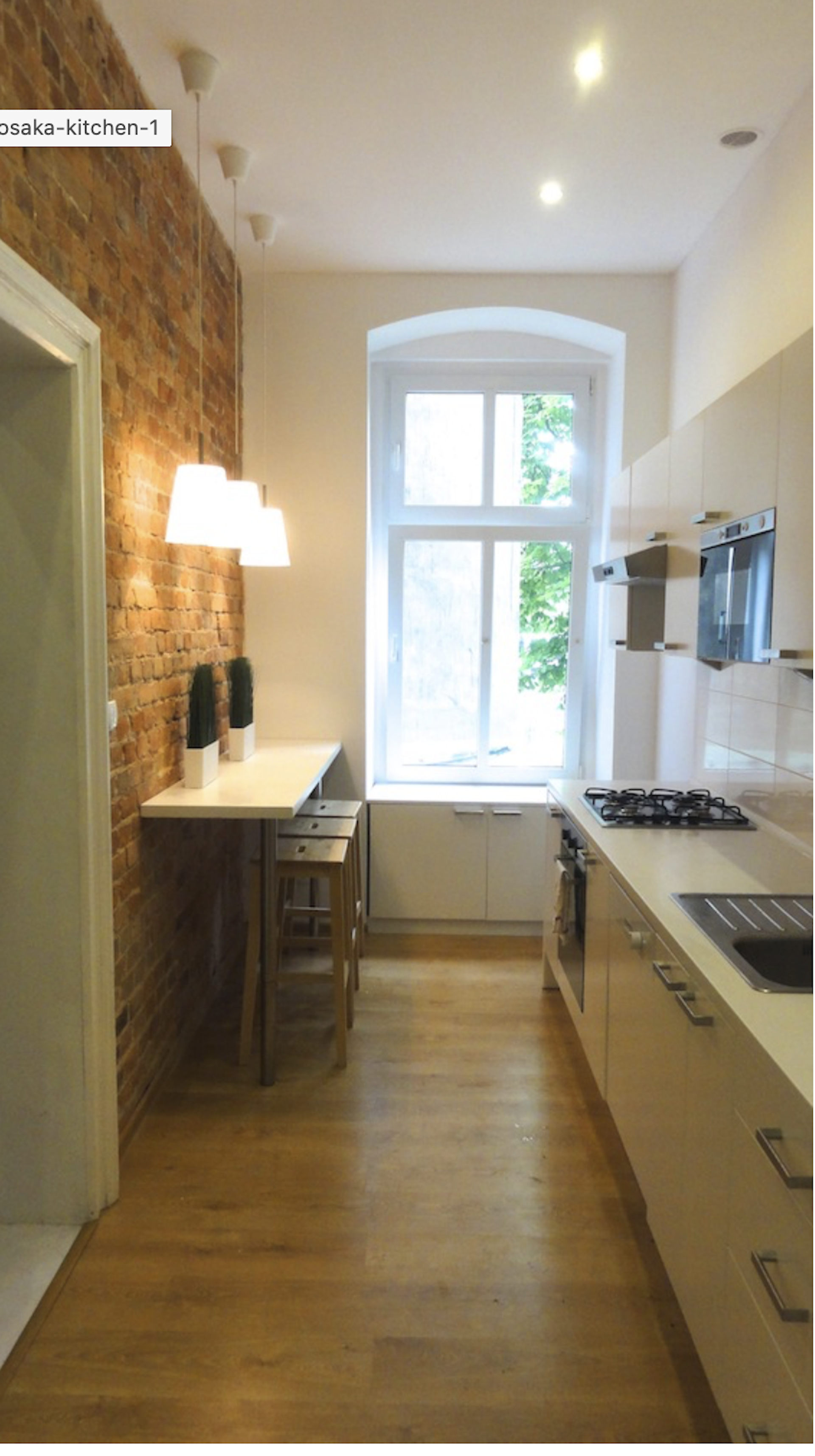 Bright kitchen with brick wall