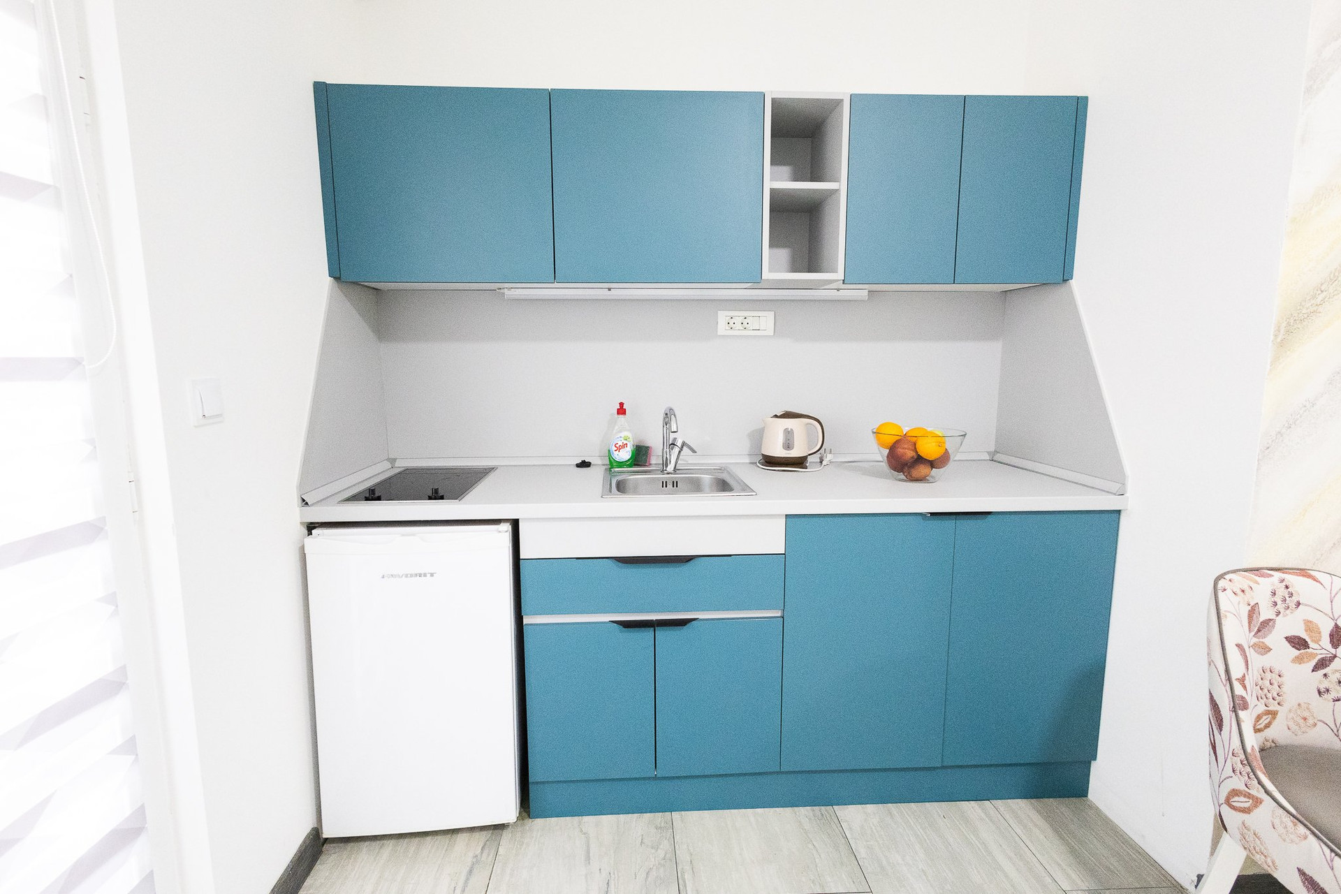 Teal compact kitchenette