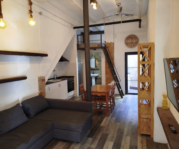 Industrial-style loft with terrace near the beach