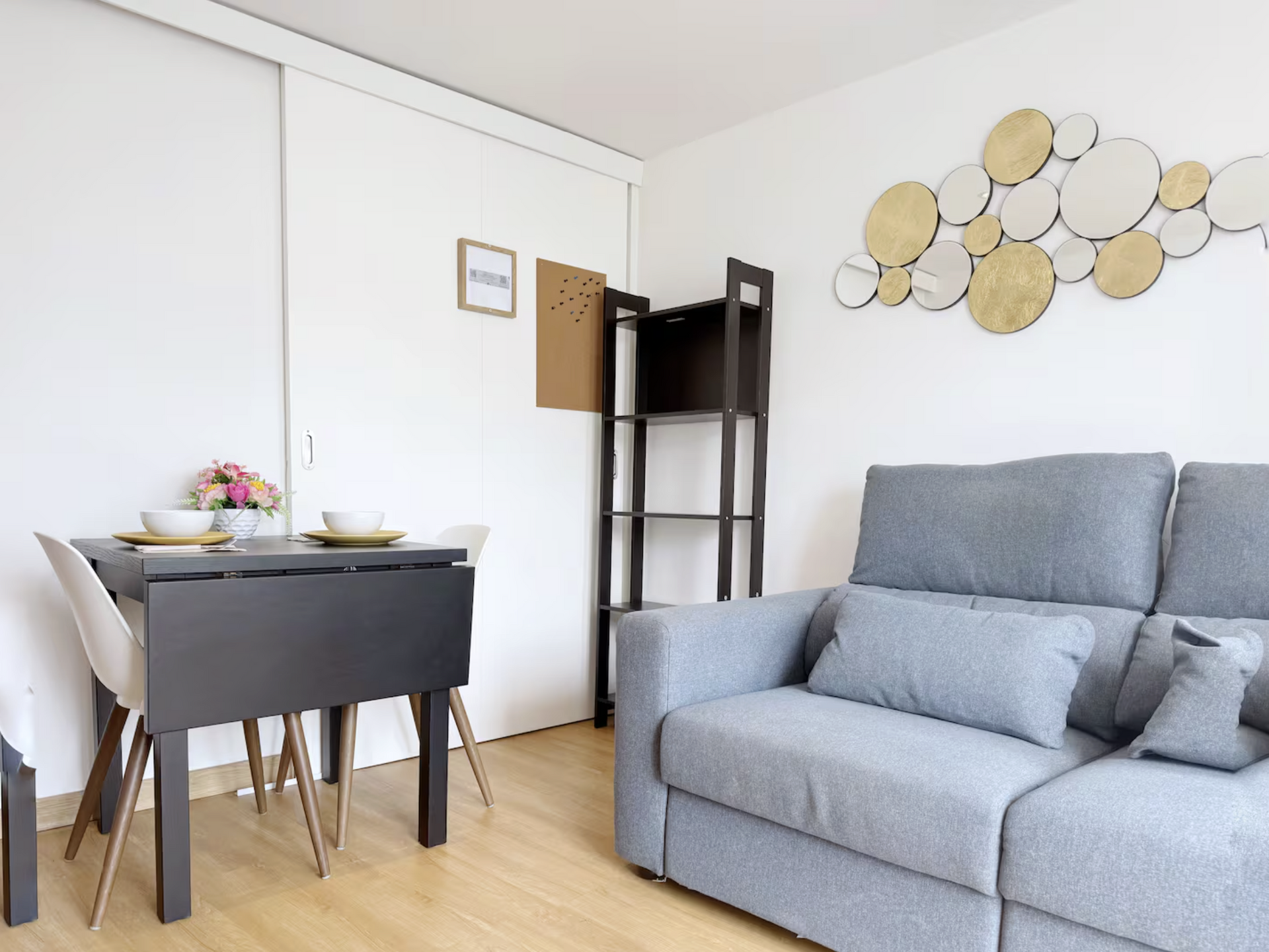 Dining area and sofa with decor