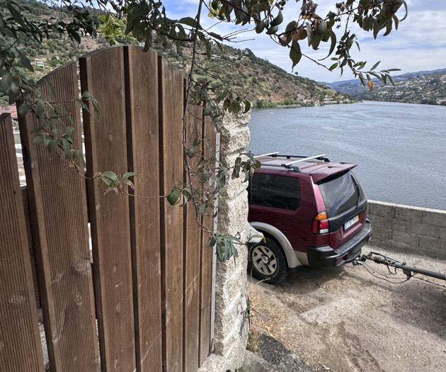 Wooden gate and parked car
