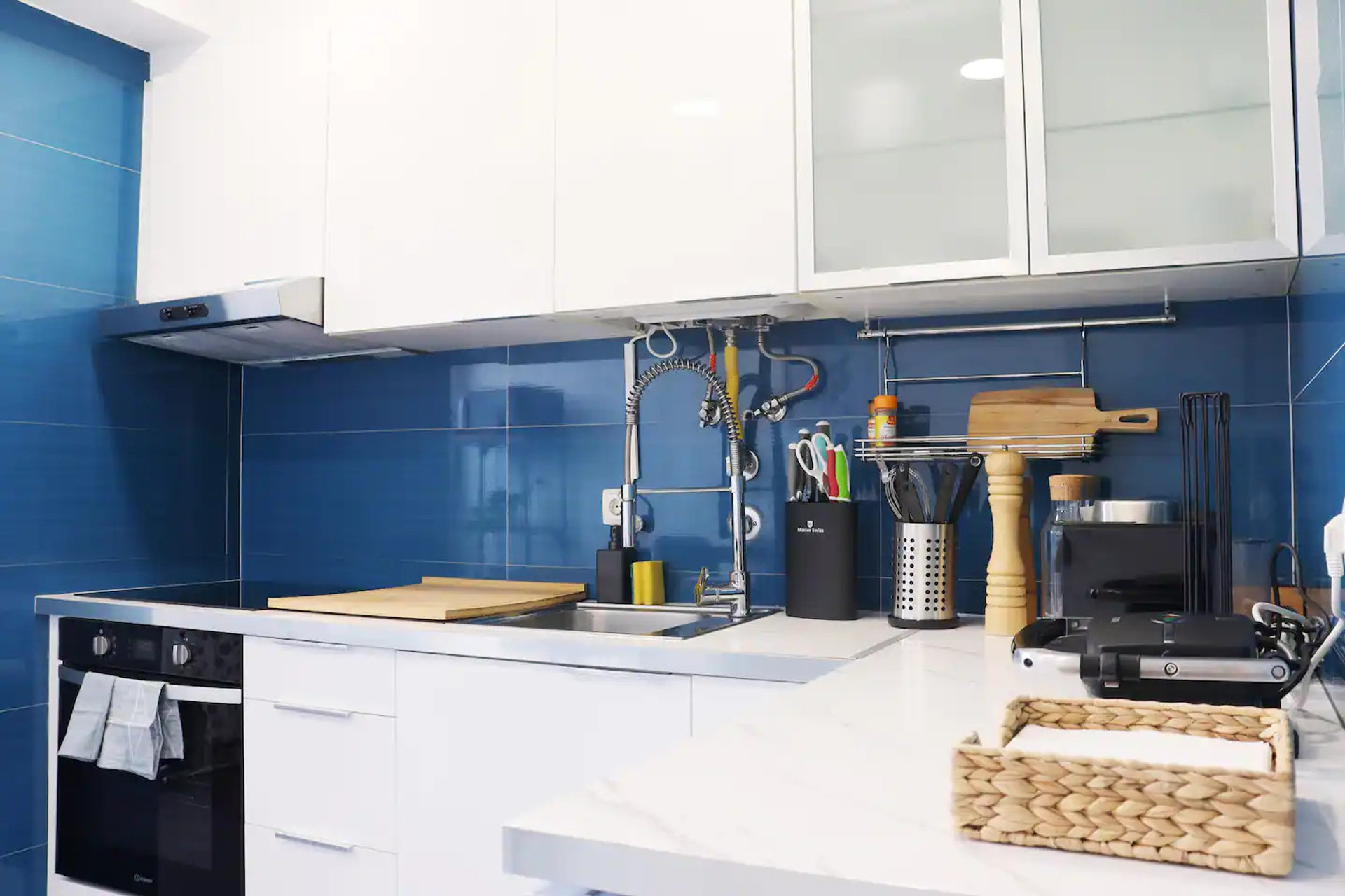 Cook up a storm in this fully equipped, modern kitchen with top-of-the-line appliances and ample counter space. Whether you're a seasoned chef or a beginner cook, this stylish setting has everything you need to create culinary masterpieces.