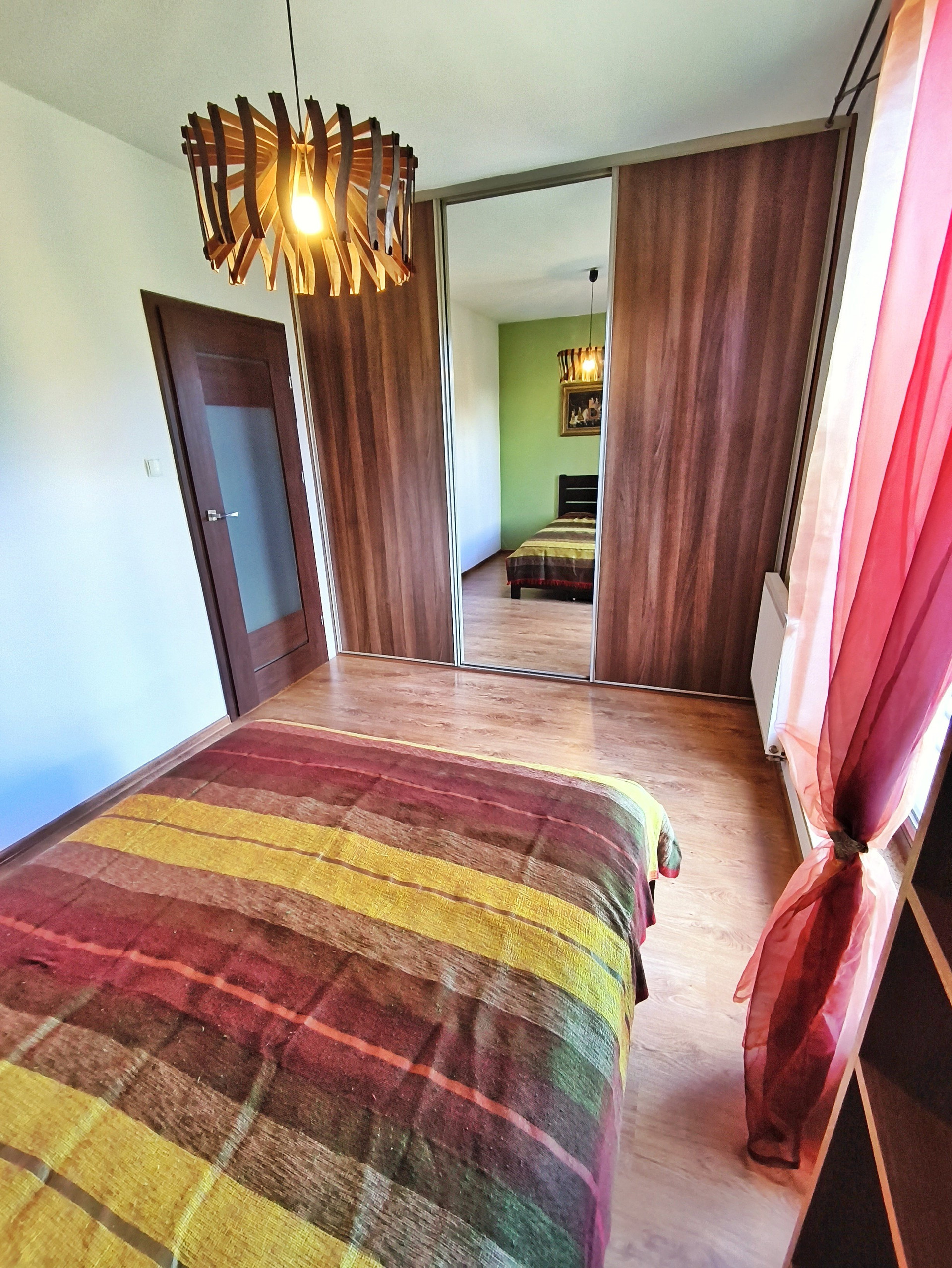 Bedroom with wardrobe and mirror