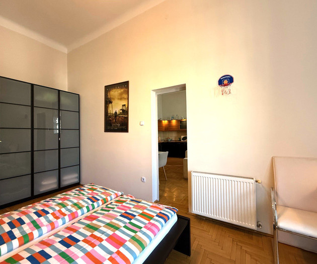 Bedroom with wardrobe and bed