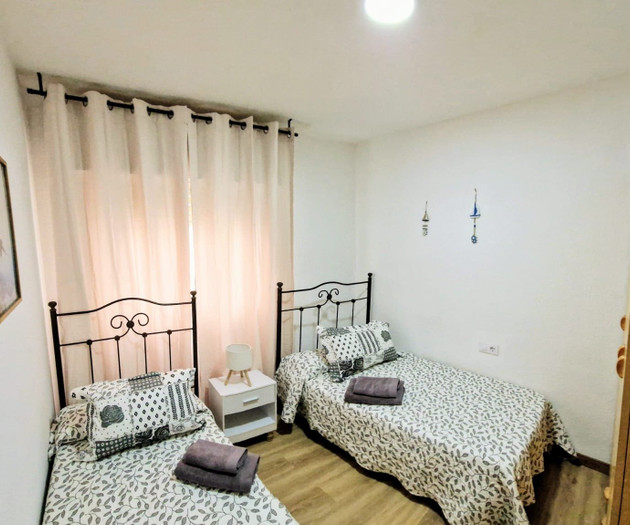 Twin bedroom with two single beds