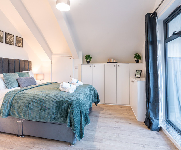 Bedroom with storage and balcony door