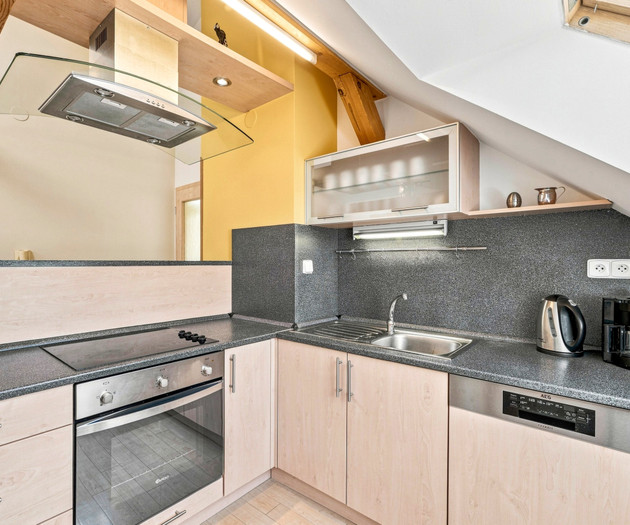 Kitchen counter with oven and hood