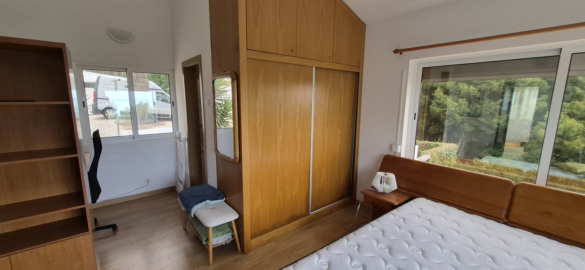 Bedroom with wardrobe and windows