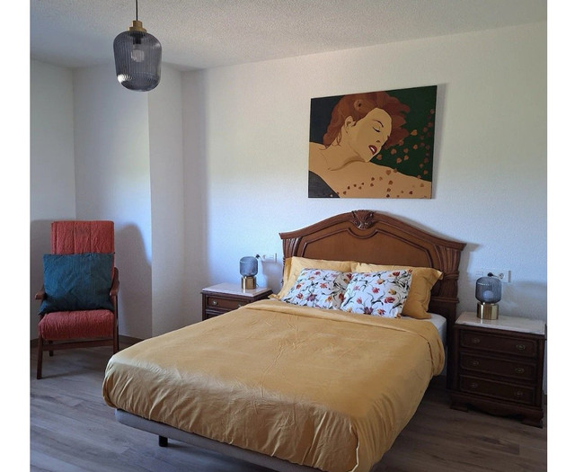 Master bedroom with armchair