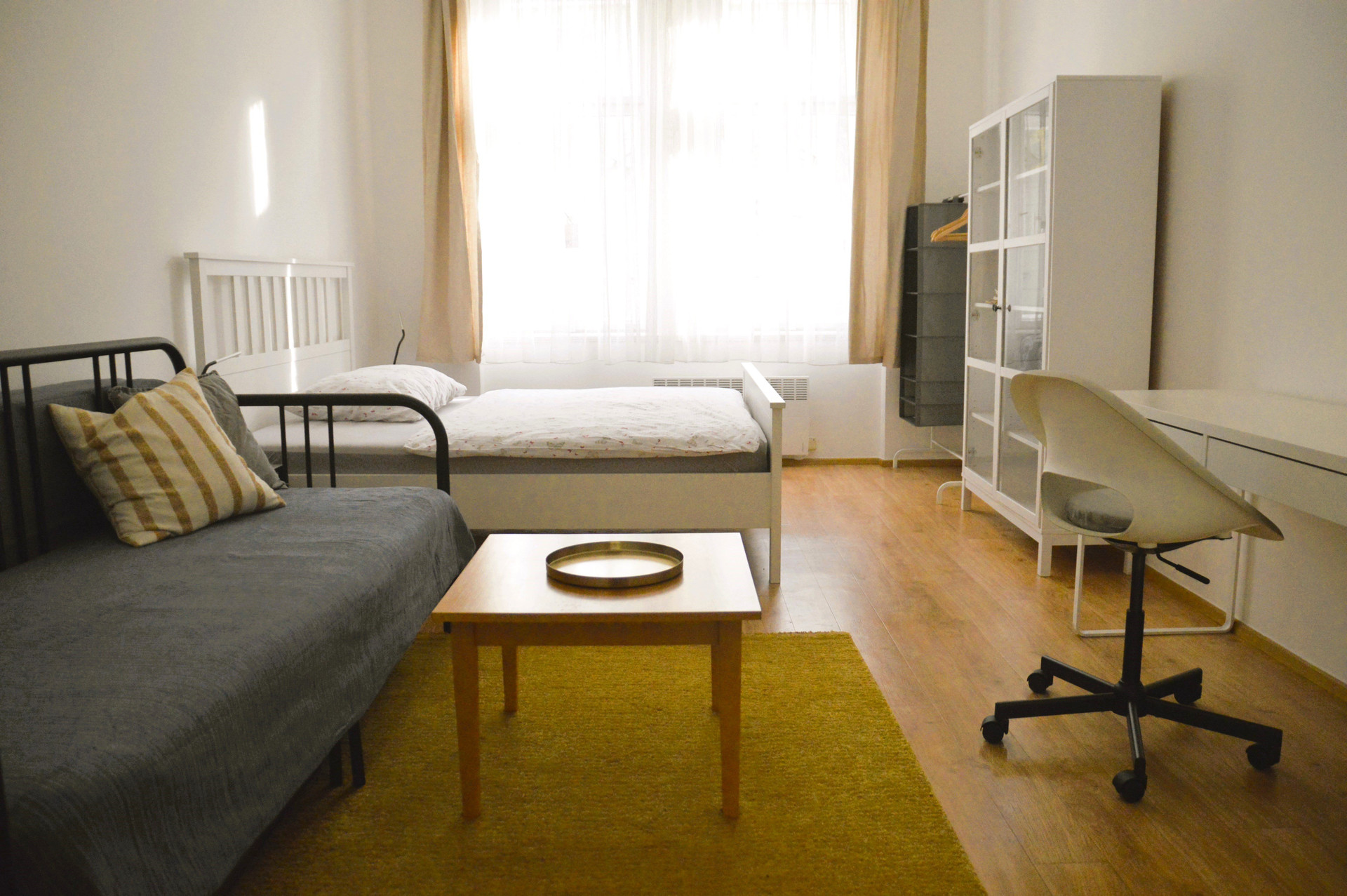 Living space with sofa and bed