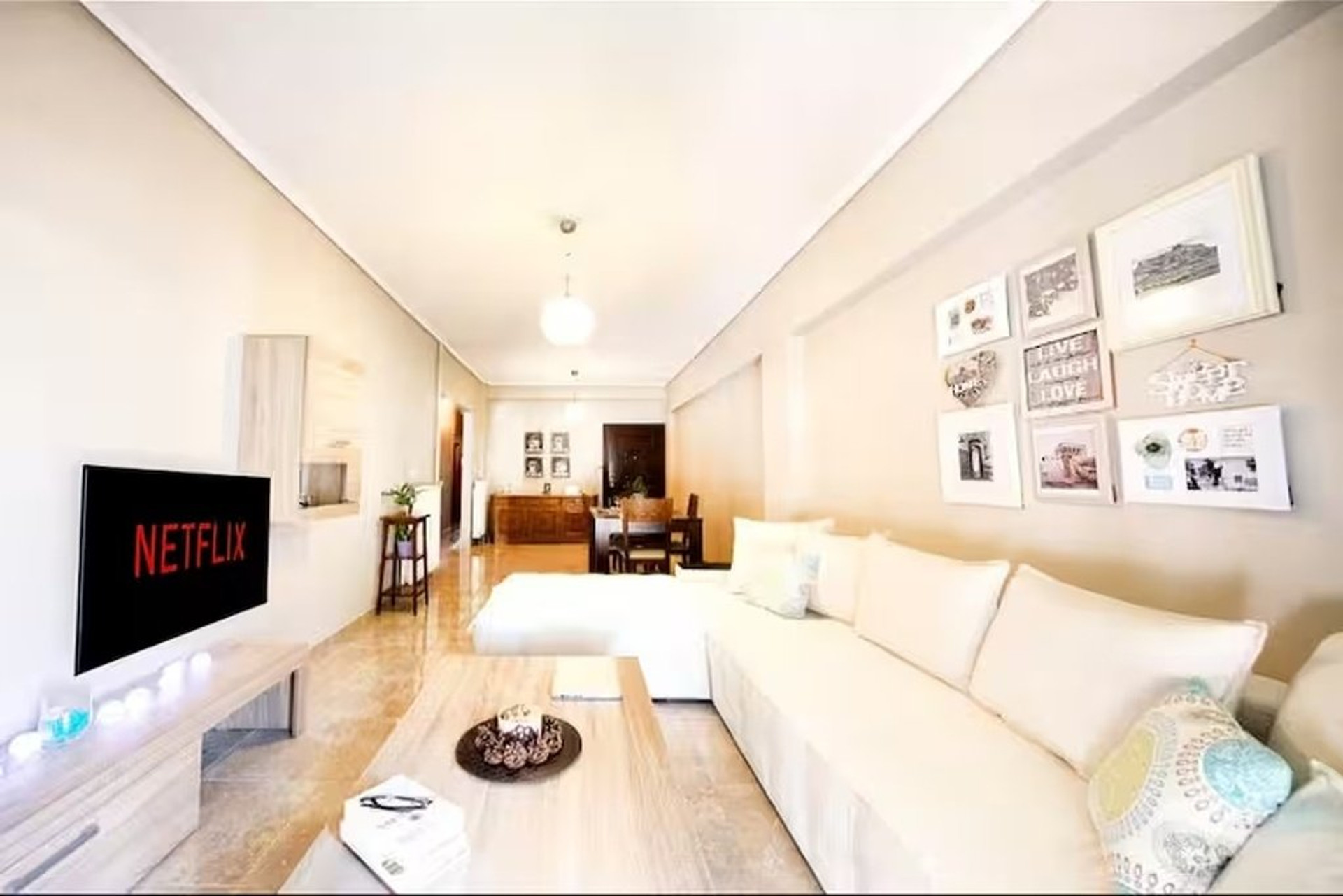 Bright living room with sofa and TV