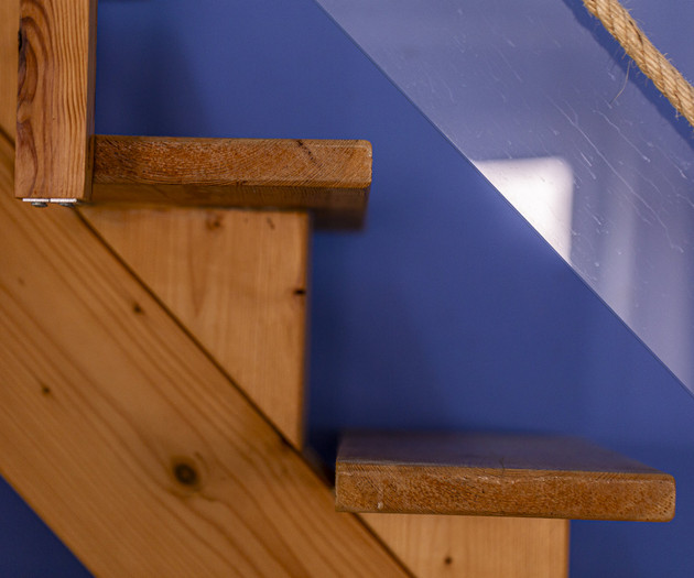 Wooden stair steps with glass railing