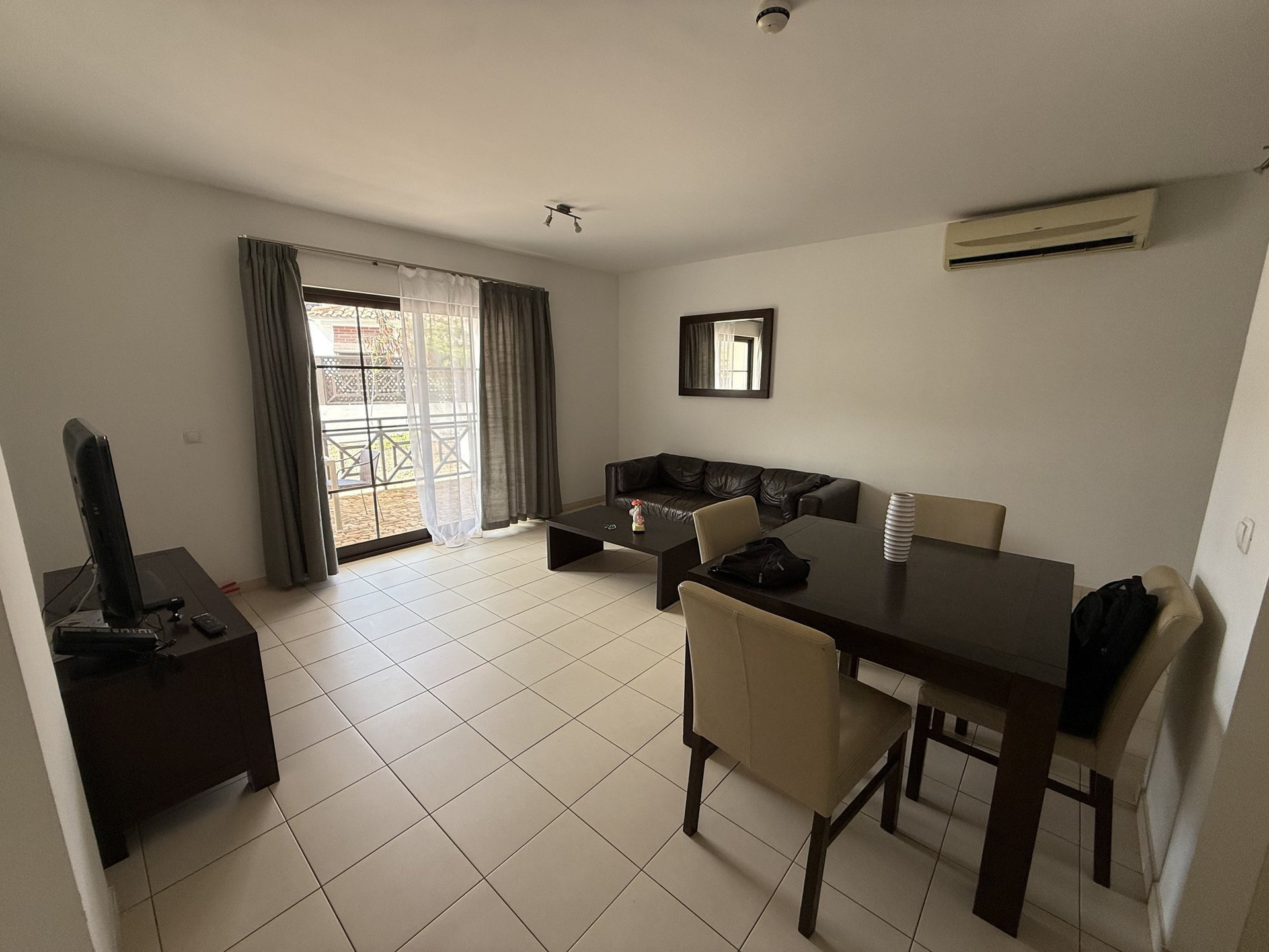 Living room with dining area and balcony