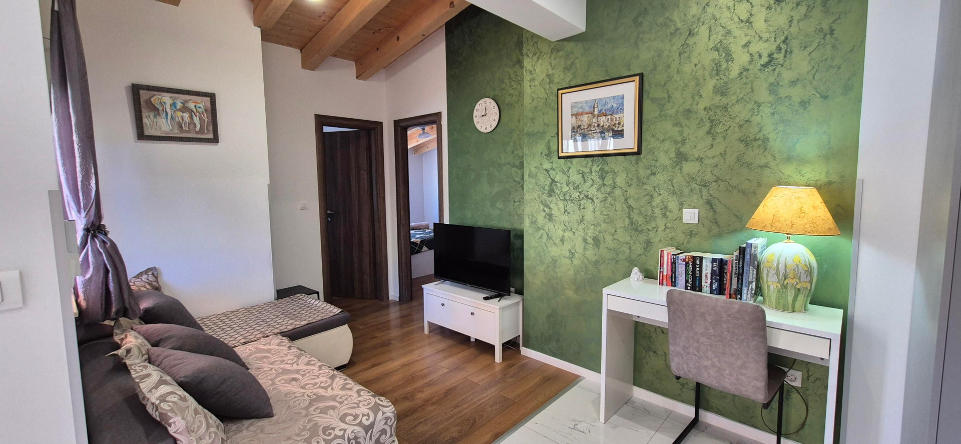 Living area with green accent wall