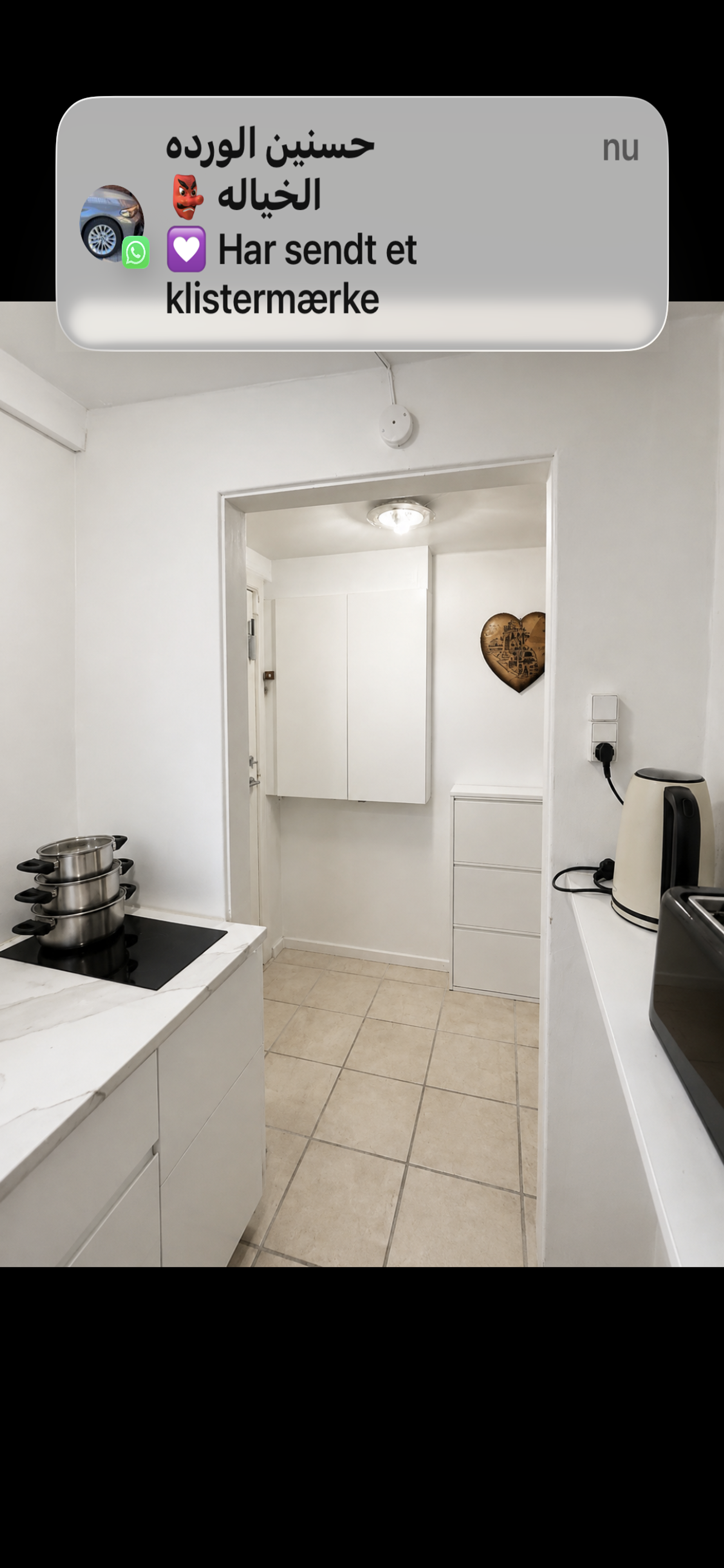 Kitchen with stove and hallway view