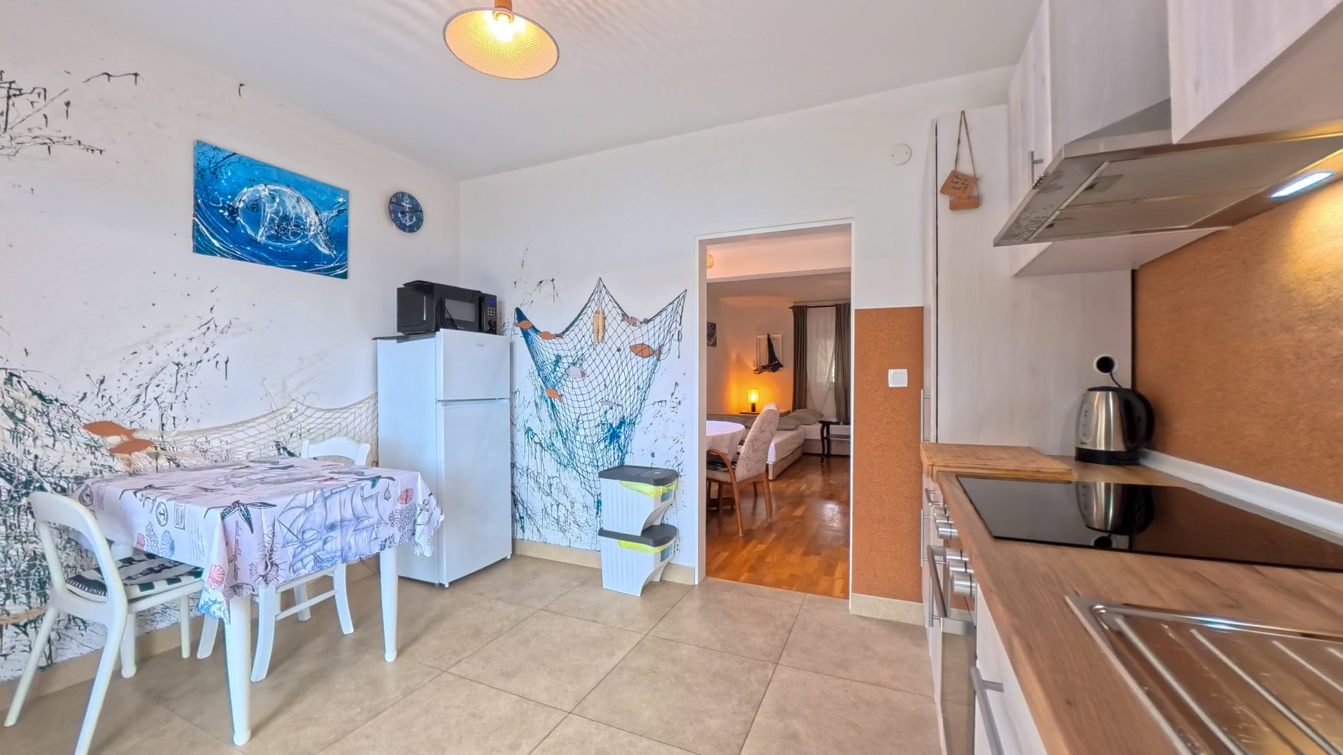 Dining area with nautical wall art